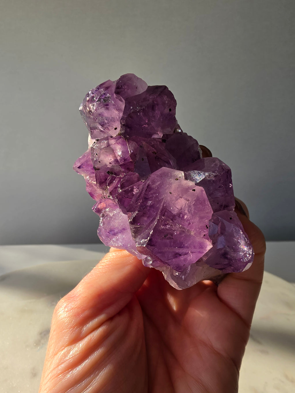 Intense purple Amethyst polished freeform with raw chunky crystal formations and natural Goethite and Hematite inclusions