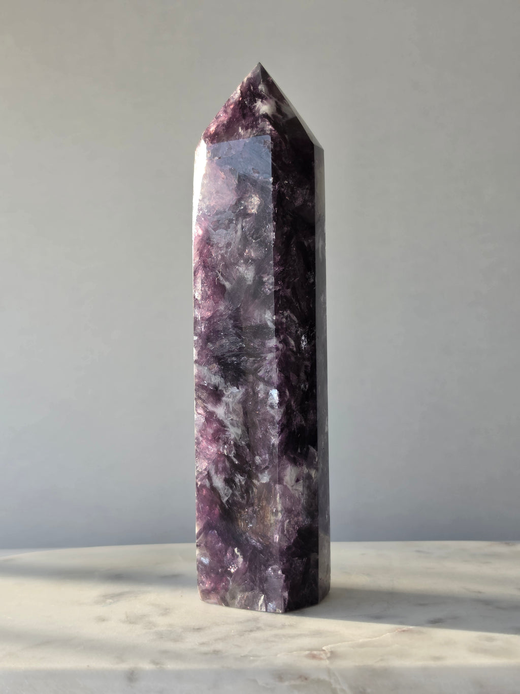 Natural Lepidolite crystal tower with rich purple tones, sparkling mica inclusions and unique lavender mineral formations