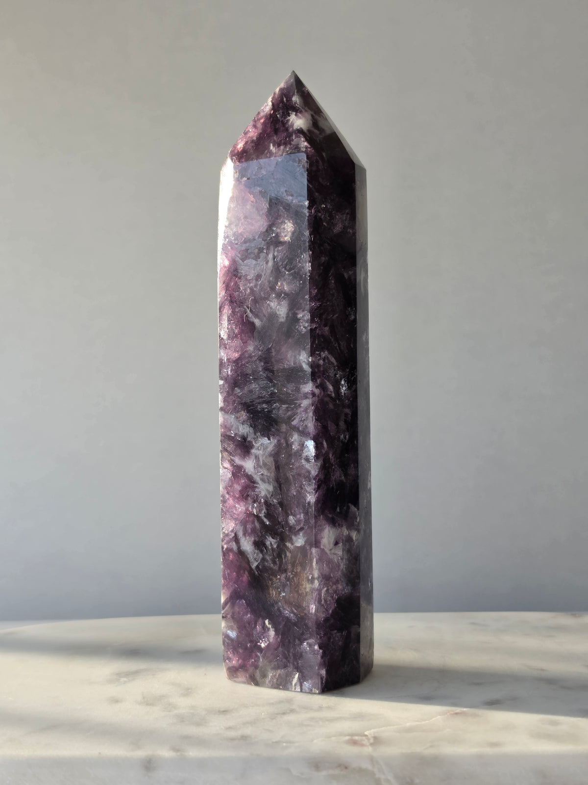 Natural Lepidolite crystal tower with rich purple tones, sparkling mica inclusions and unique lavender mineral formations