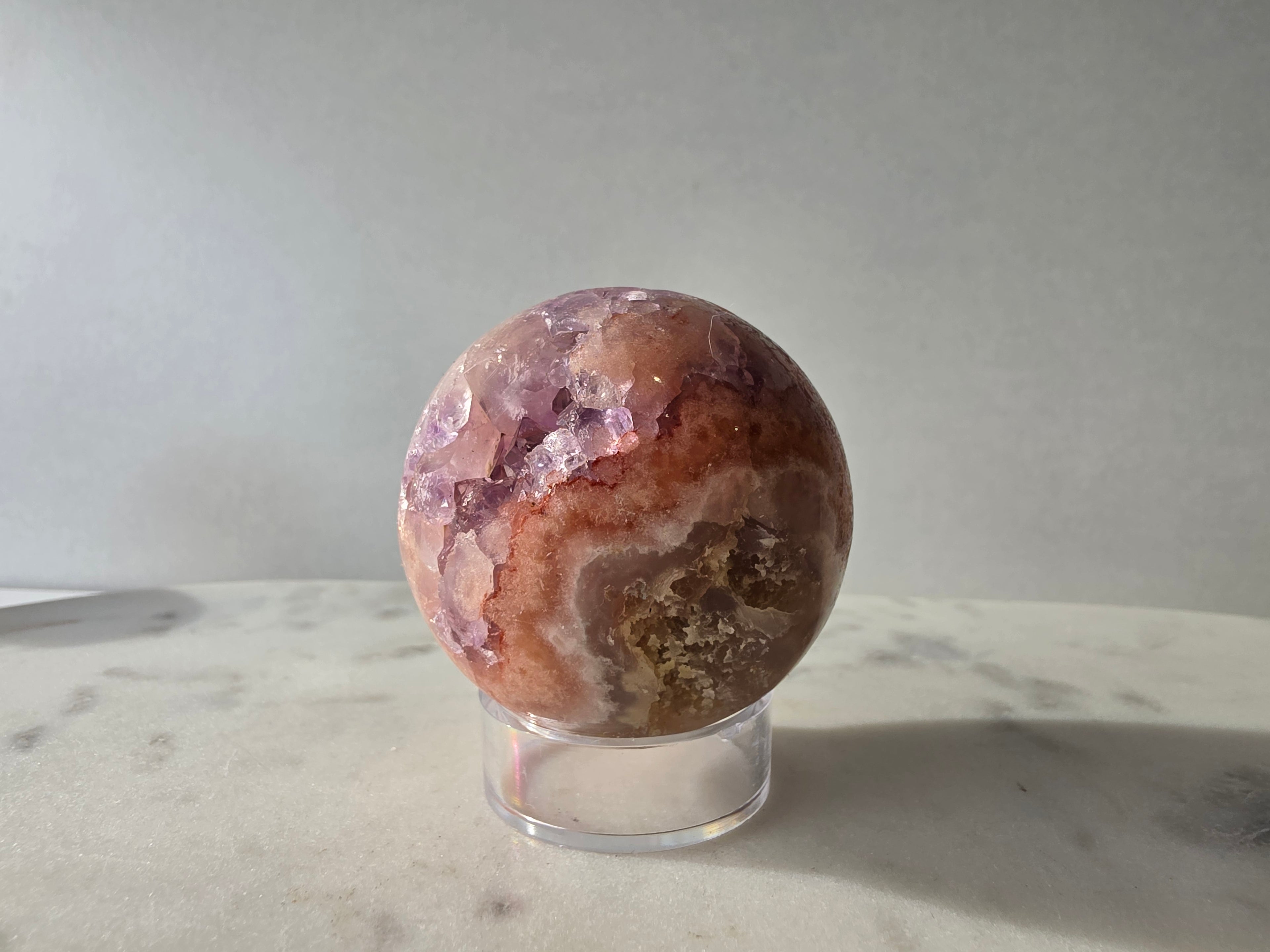 Luxury Pink Amethyst crystal sphere from Brazil with soft blush and lilac tones and a dramatic sparkling crystalline interior