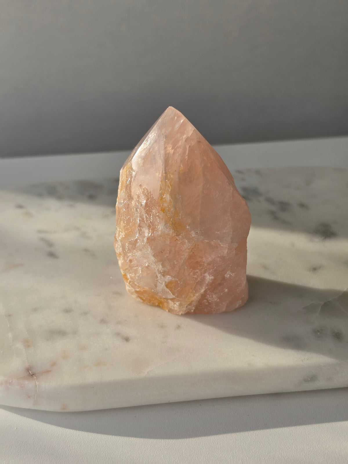 Chunky Rose Quartz and Golden Healer Quartz tower with soft blush pink colouring, warm golden inclusions and a combination of raw crystal texture and polished surfaces