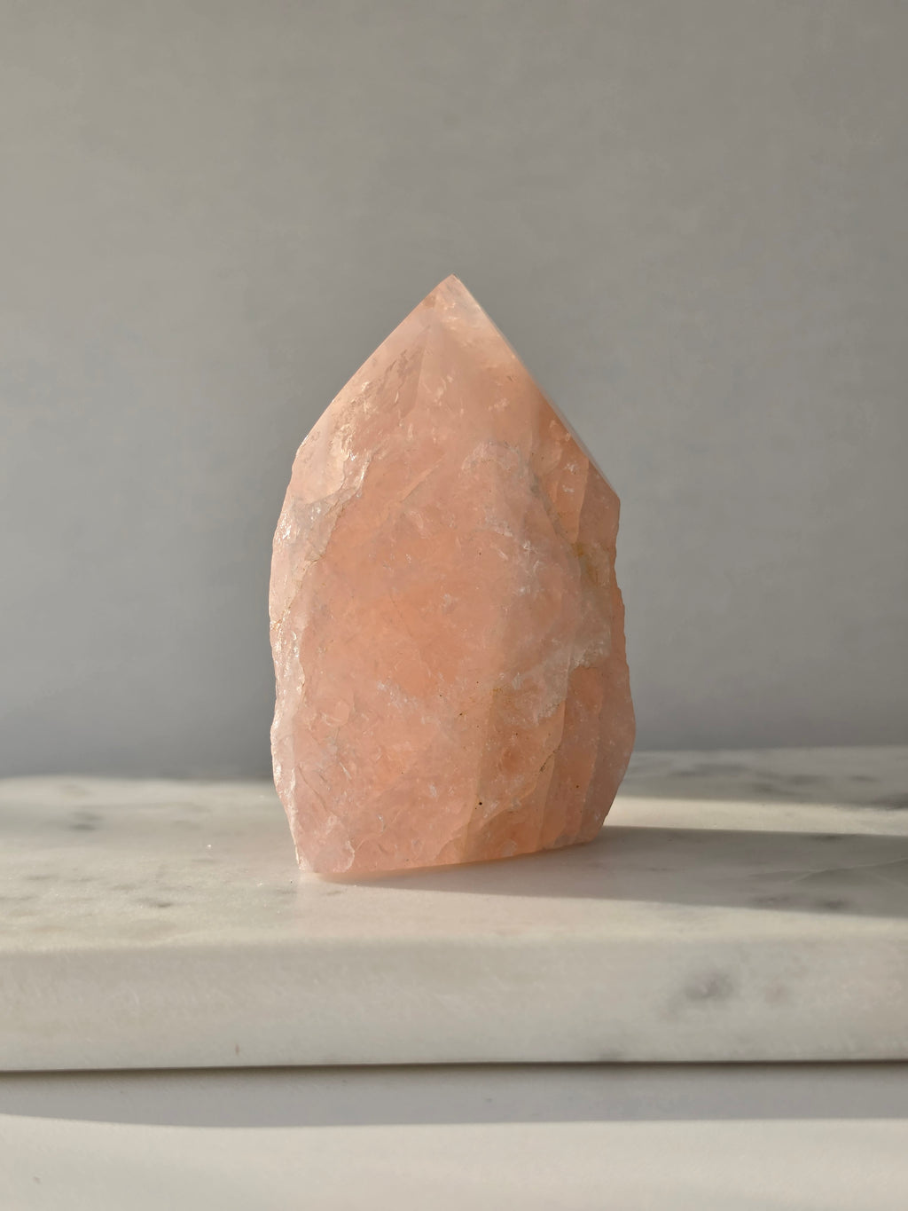 Chunky Rose Quartz and Golden Healer Quartz tower with soft blush pink colouring, warm golden inclusions and a combination of raw crystal texture and polished surfaces