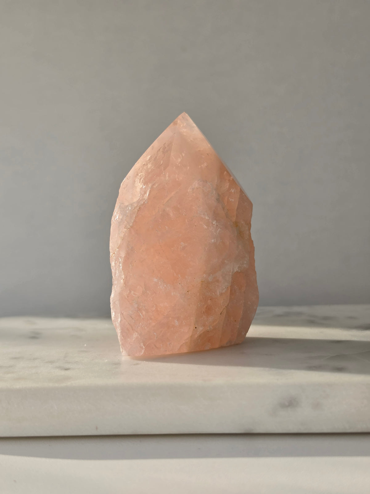 Chunky Rose Quartz and Golden Healer Quartz tower with soft blush pink colouring, warm golden inclusions and a combination of raw crystal texture and polished surfaces