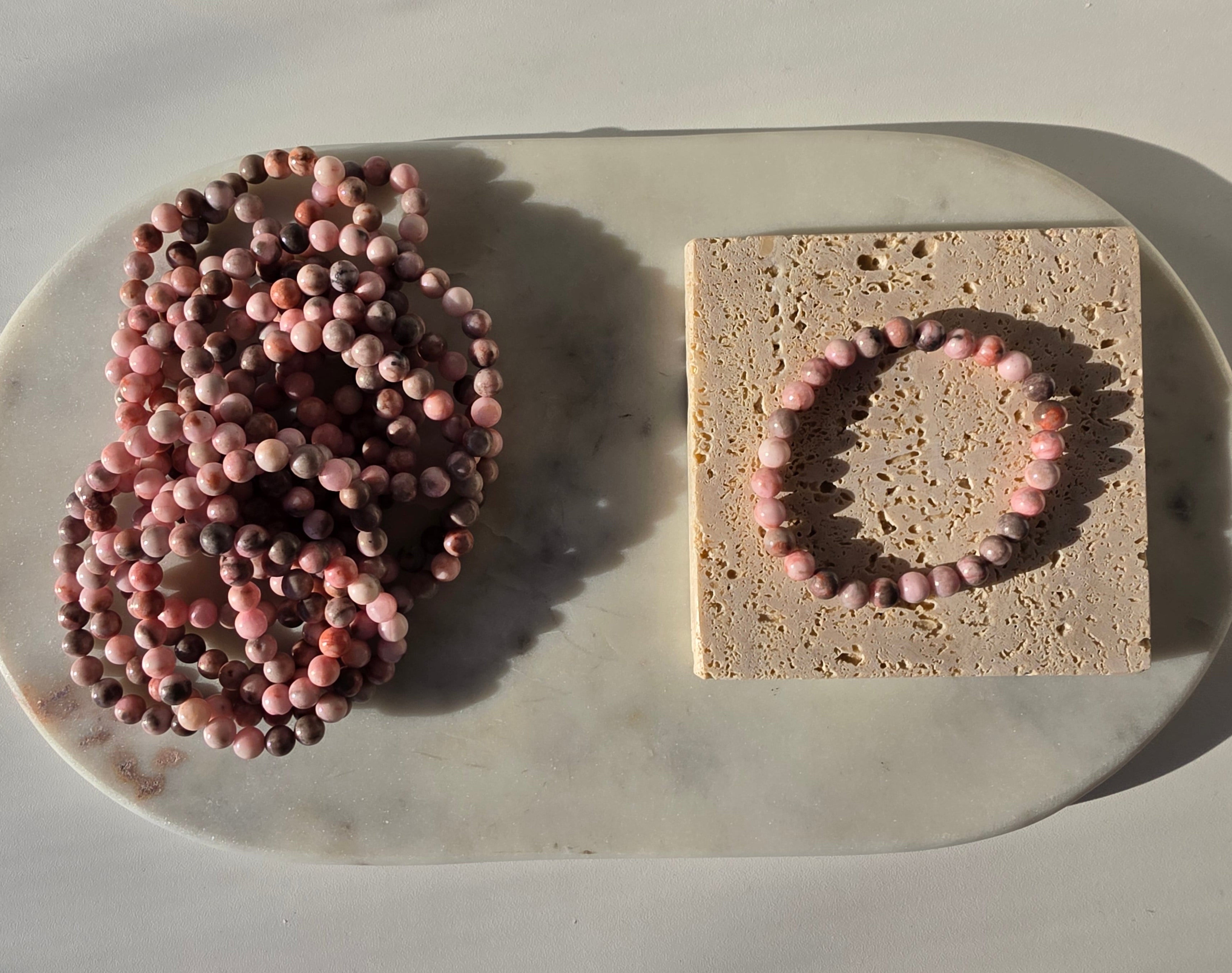 High-grade natural Pink Opal beaded bracelets featuring soft blush pink, dusty rose, mauve, and taupe gemstones with a smooth polished finish, handcrafted with premium quality stones and photographed in natural light.
