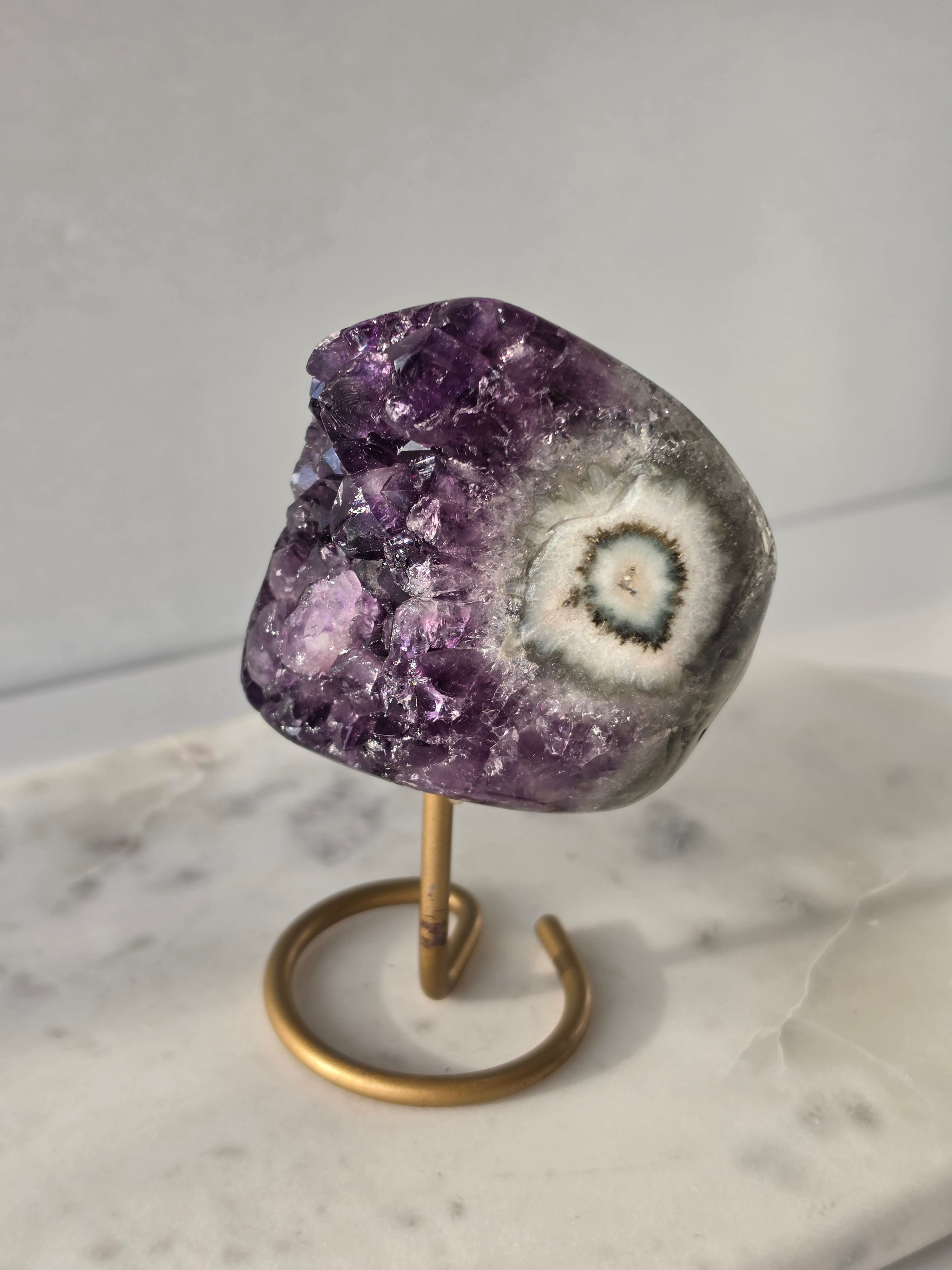 Natural Deep Purple Amethyst Stalactite on a gold display stand