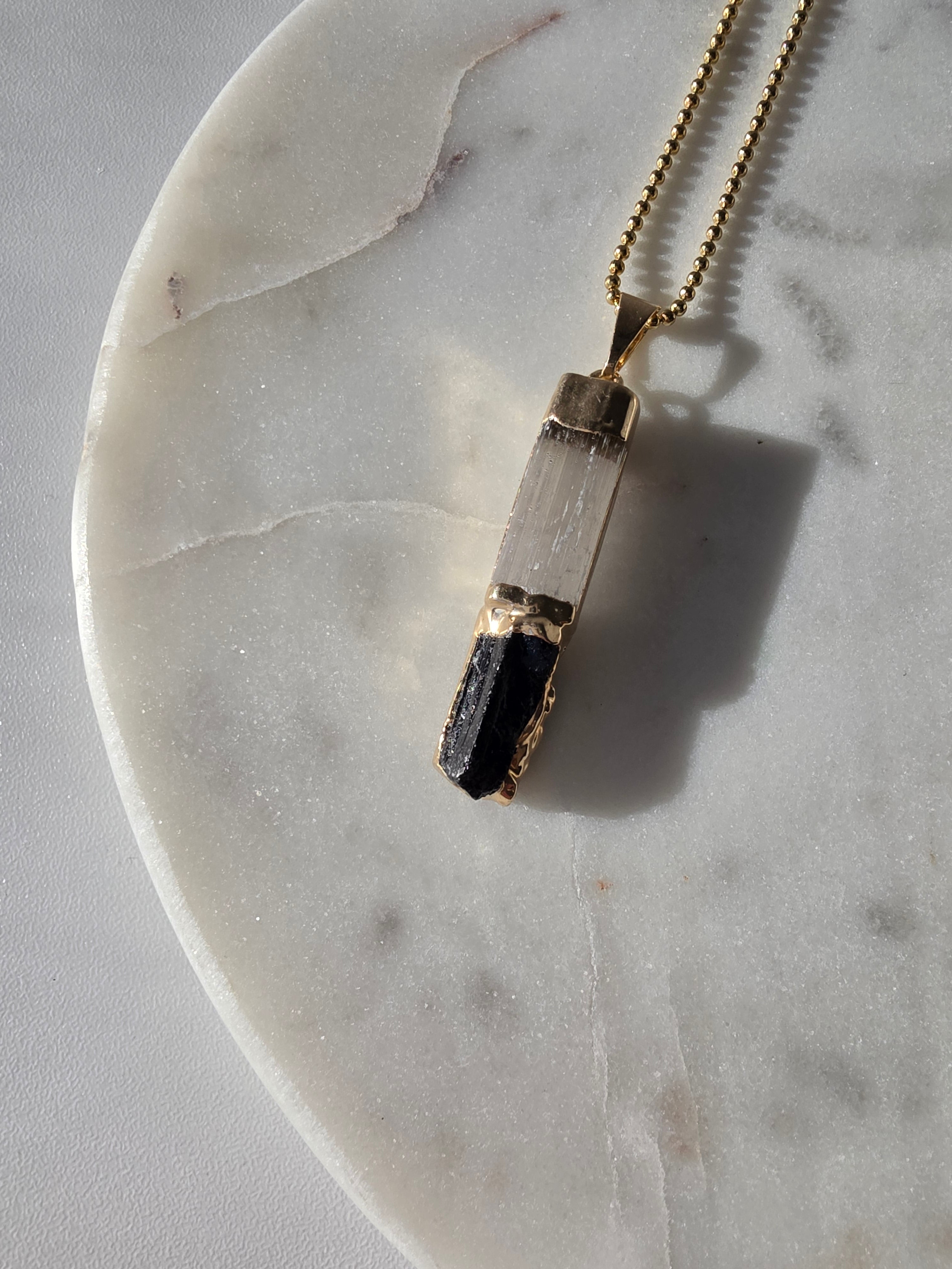 Natural Selenite and Black Tourmaline crystal pendant in a refined 24K Gold Plated setting, Stone & Bloom Raw Luxe Collection