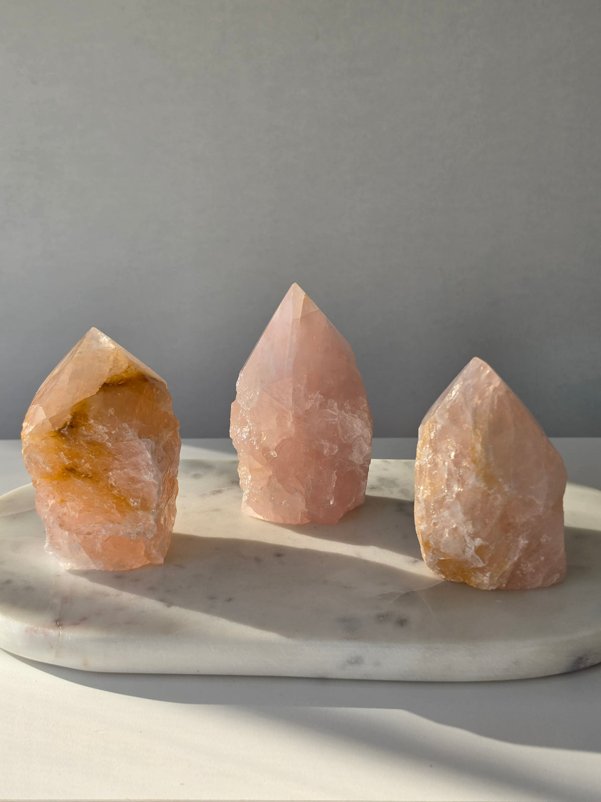 Chunky Rose Quartz and Golden Healer Quartz tower with soft blush pink colouring, warm golden inclusions and a combination of raw crystal texture and polished surfaces