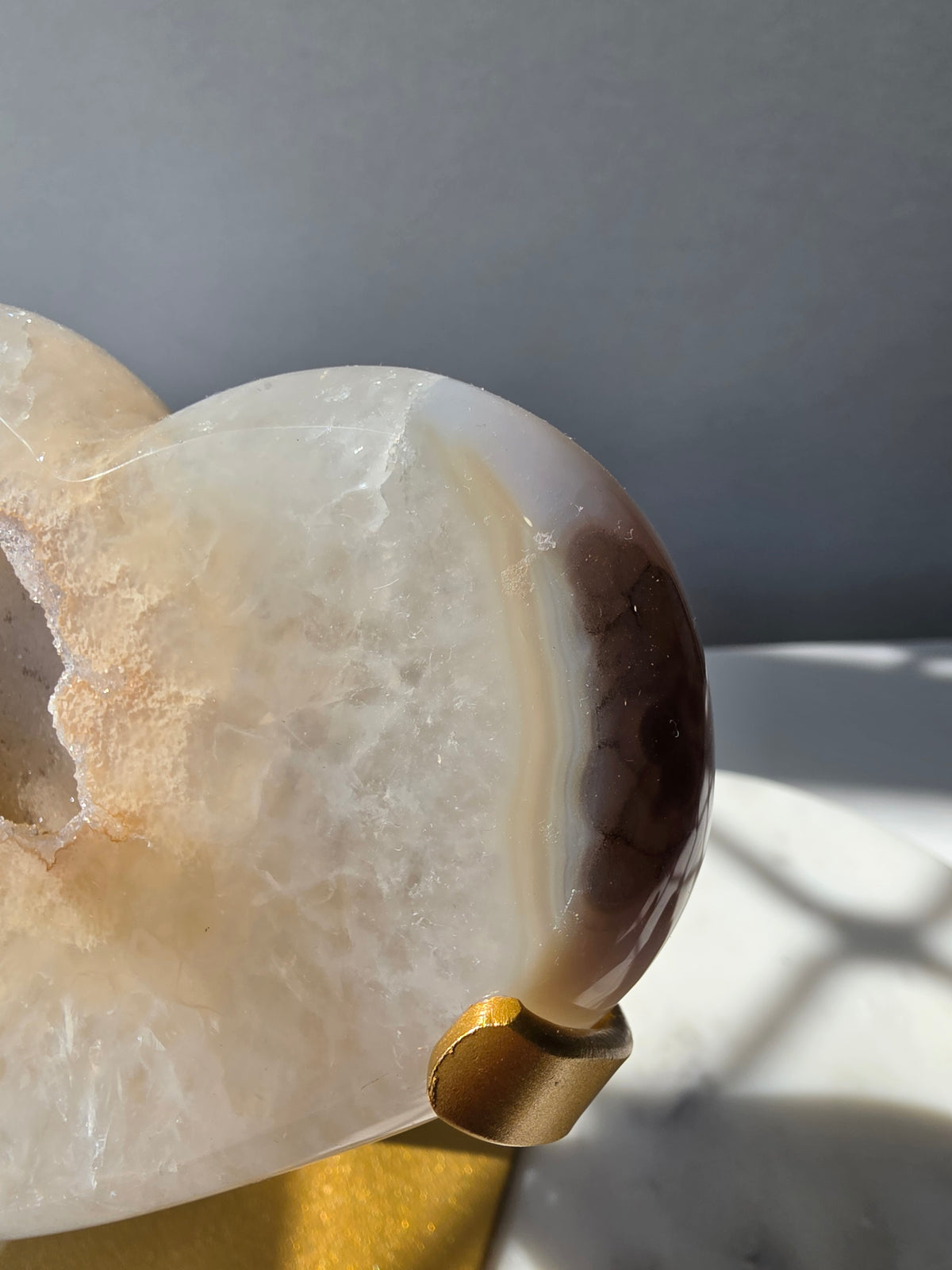 High Clarity Druzy Agate Geode Heart on a gold stand featuring sparkling druzy quartz crystals and natural champagne, caramel, ivory, taupe and smoky-grey agate banding.