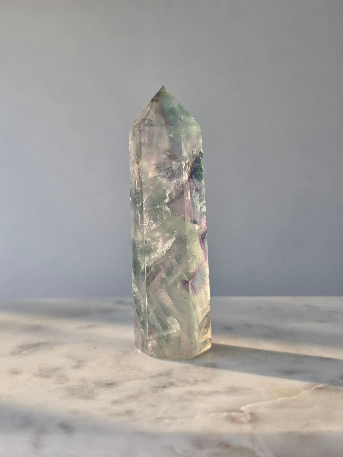 Natural Fluorite crystal point Translucent clarity with rainbow shine purple and light green colour zoning, transparent polished finish and unique internal formations