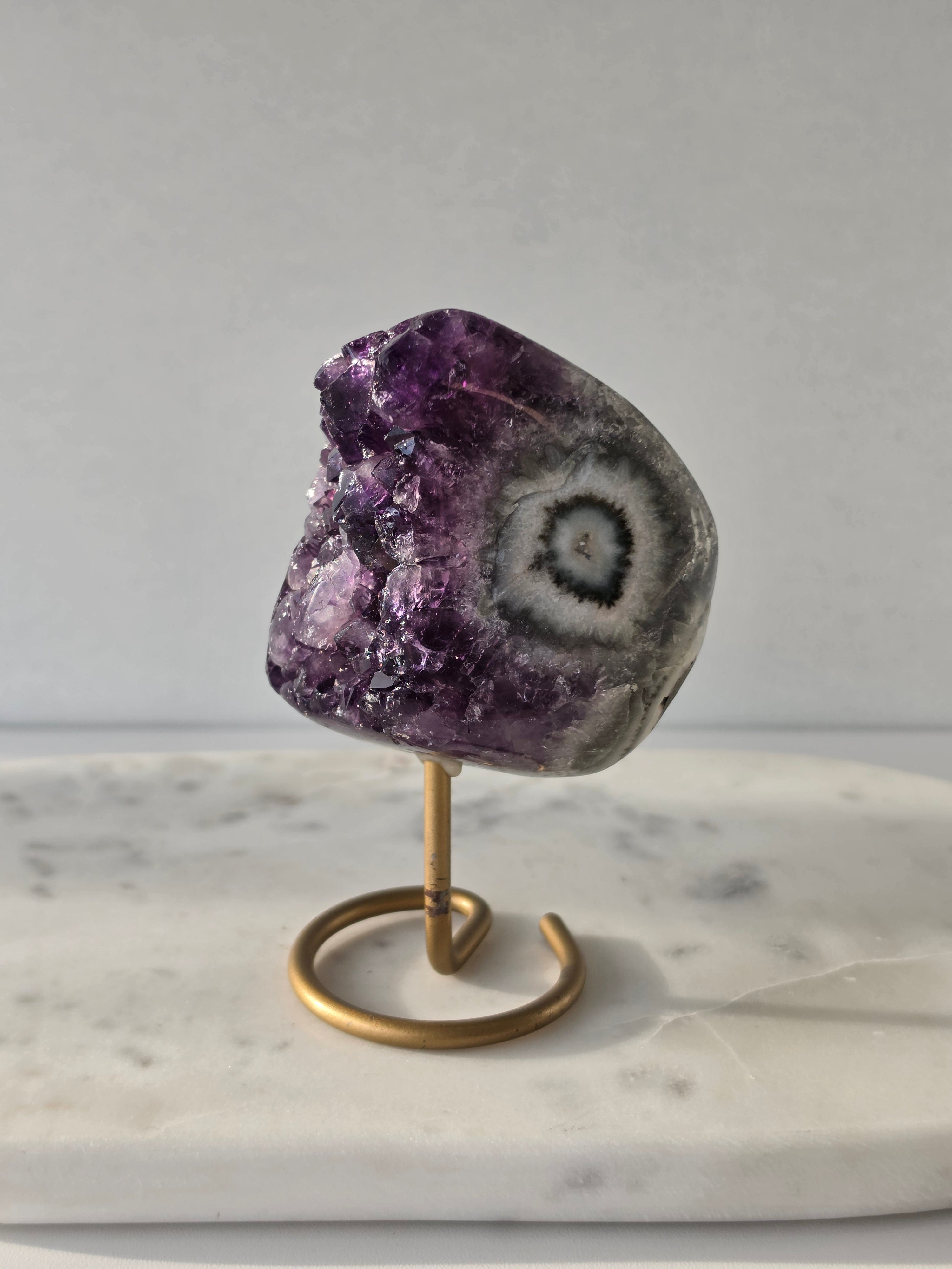 Natural Deep Purple Amethyst Stalactite on a gold display stand