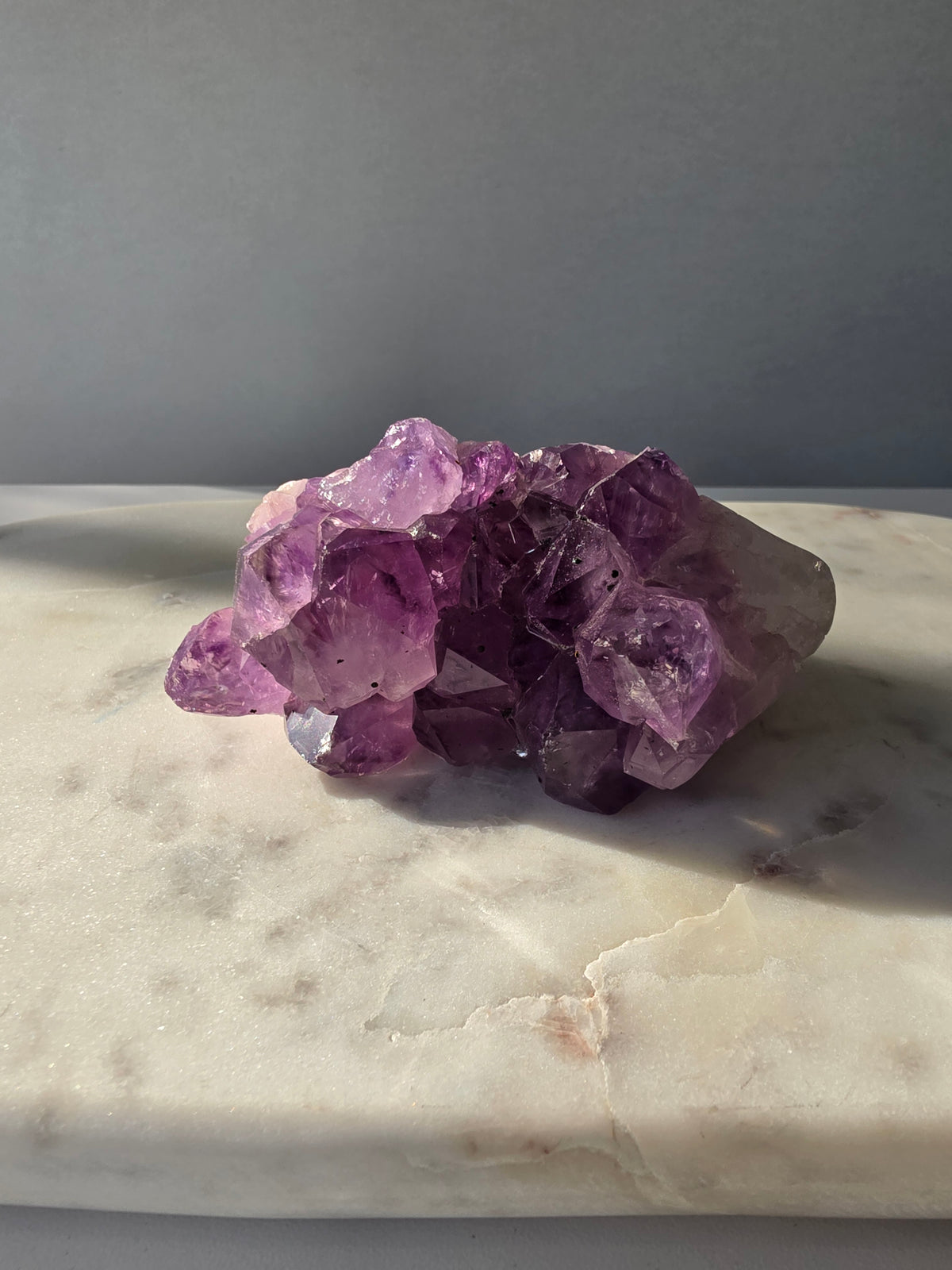 Intense purple Amethyst polished freeform with raw chunky crystal formations and natural Goethite and Hematite inclusions