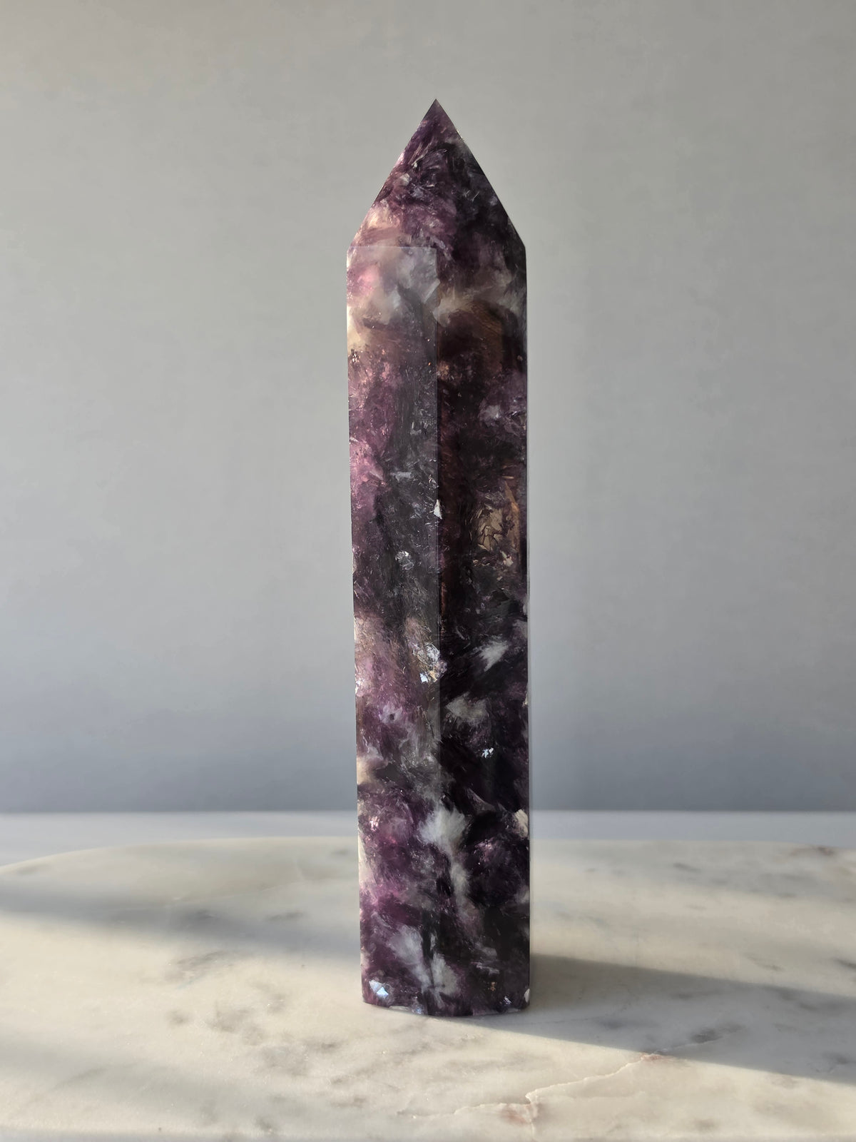 Natural Lepidolite crystal tower with rich purple tones, sparkling mica inclusions and unique lavender mineral formations