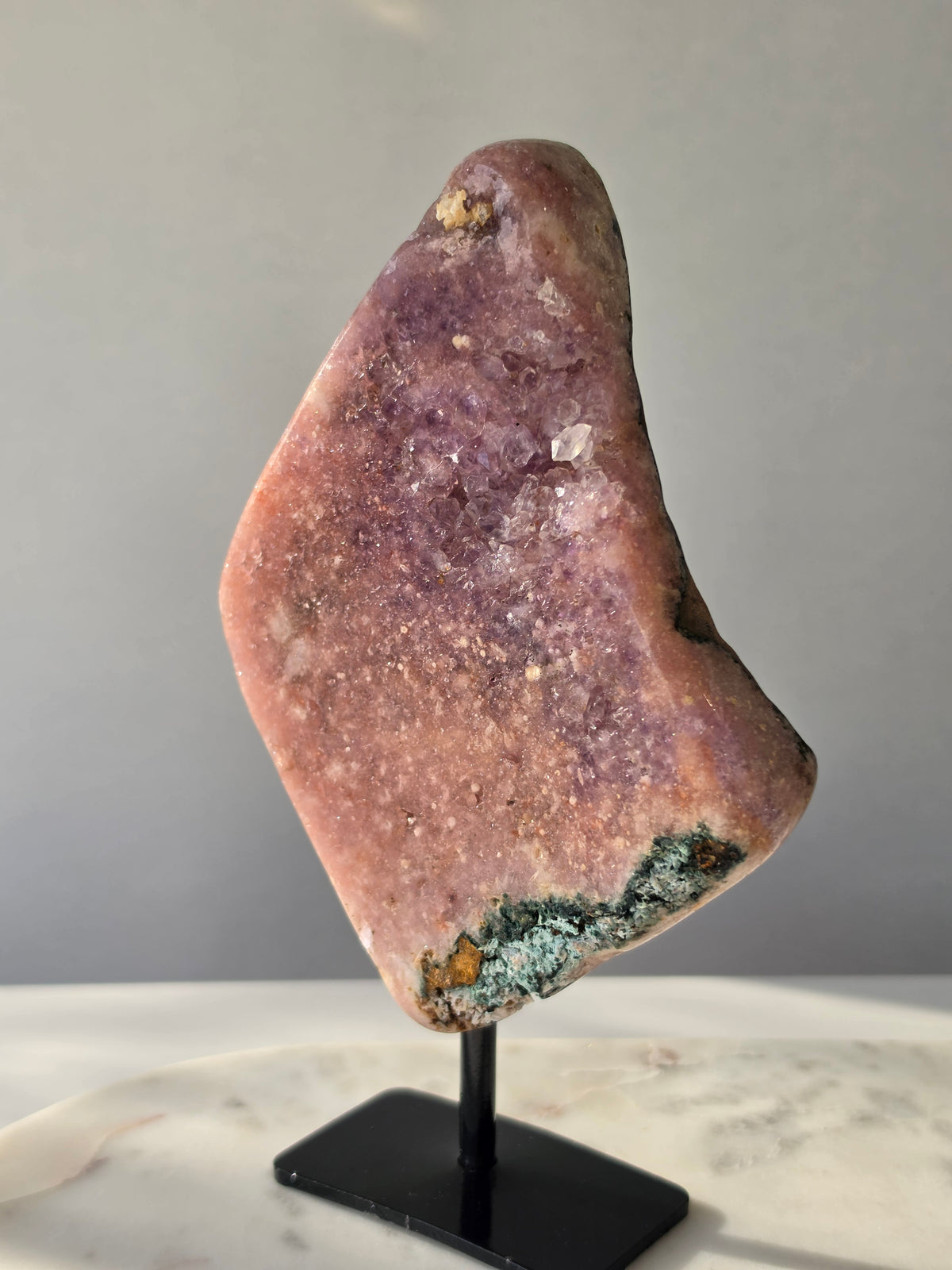 Brazilian Pink Amethyst slab on display stand with rich pink and purple colouring, sparkling purple and pink druzy and natural Jasper inclusions, 645g and 18.5cm