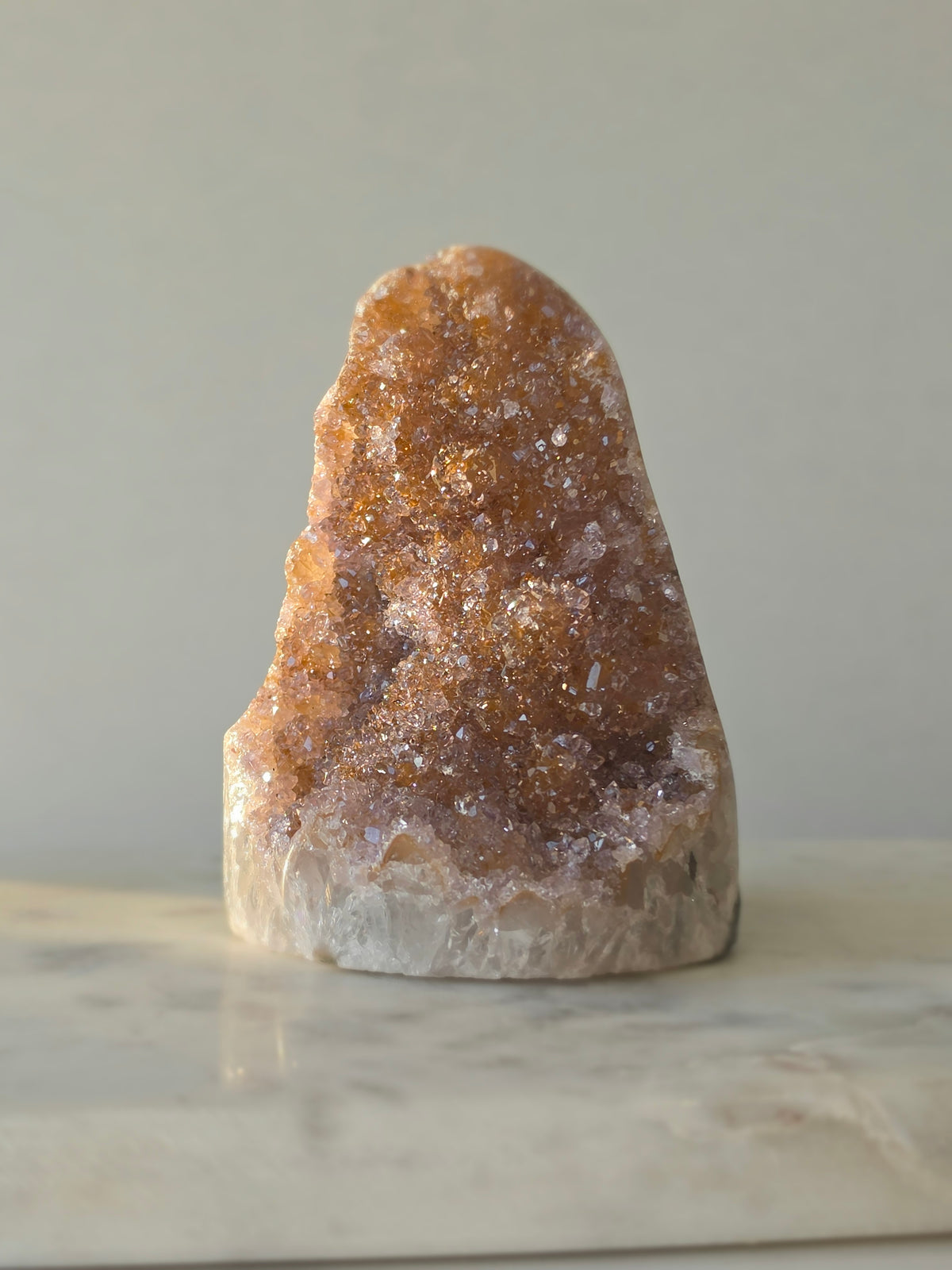 Druzy Golden Amethyst cut base from Uruguay with intensely sparkling crystal druzy surface and warm golden lilac and pink tones 482g 10cm