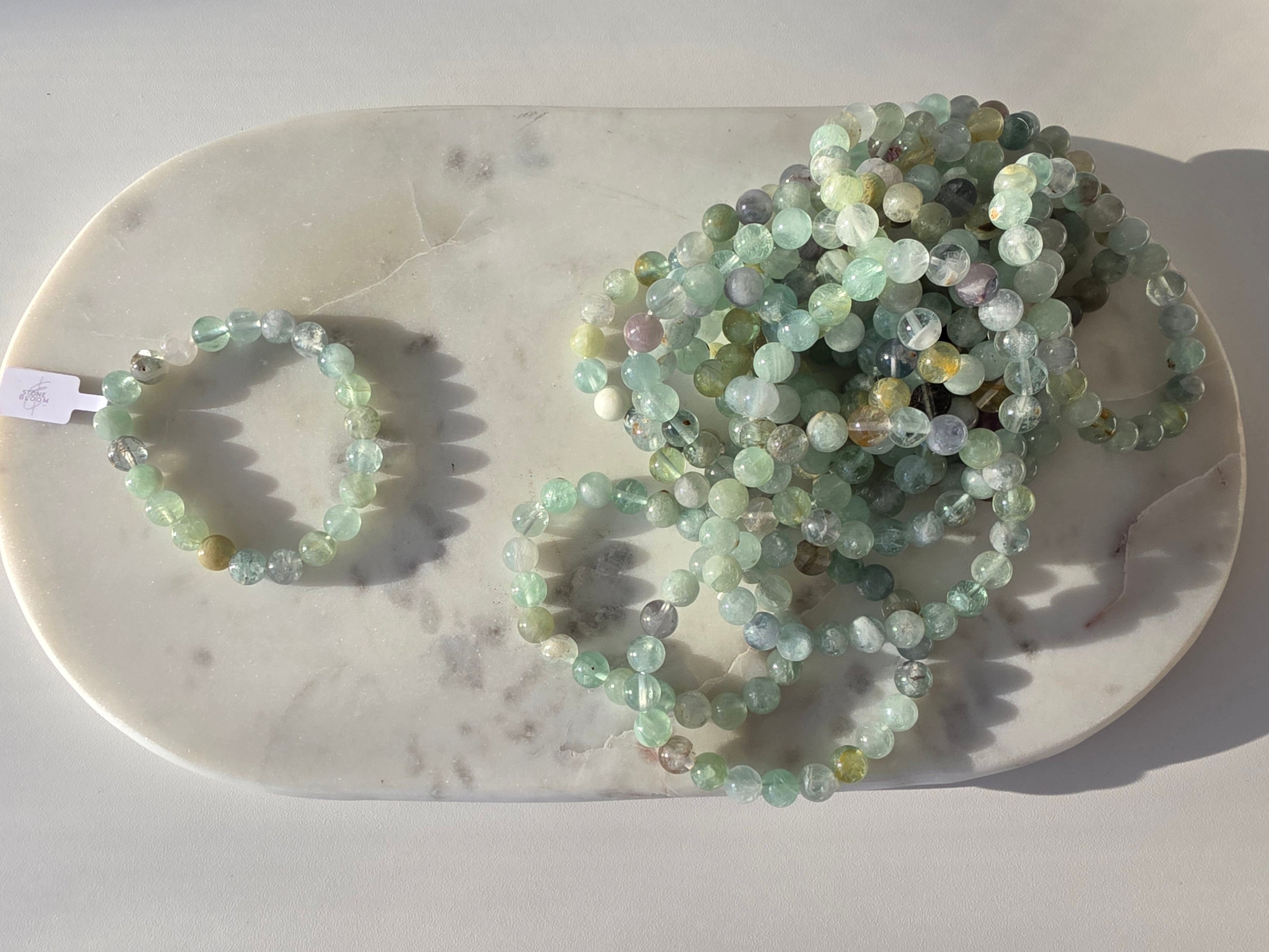 Natural Green Fluorite bracelet with polished translucent mint-green gemstone beads, luxury crystal jewellery by Stone & Bloom.
