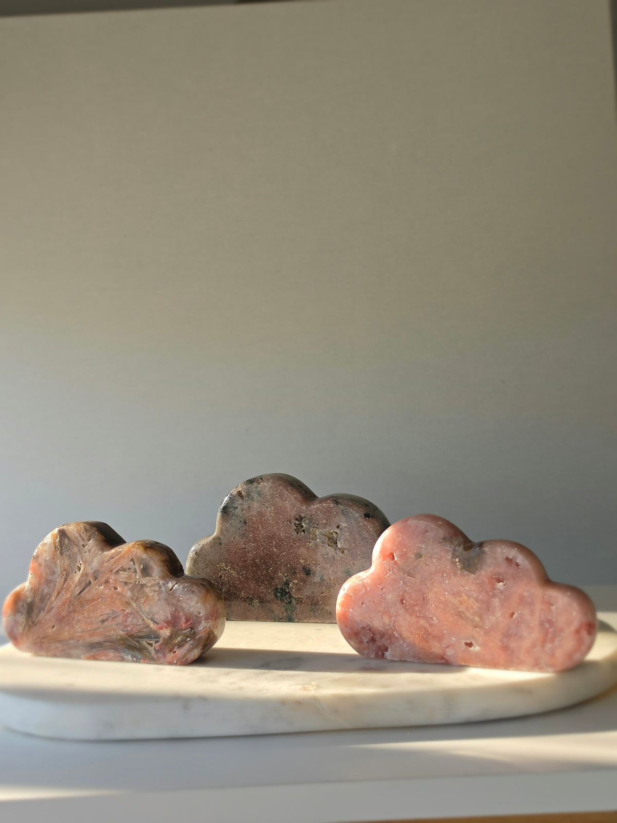 Natural Brazilian Pink Amethyst Cloud with soft blush pink and peach tones, unique blue-green mineral inclusions and polished sculptural finish