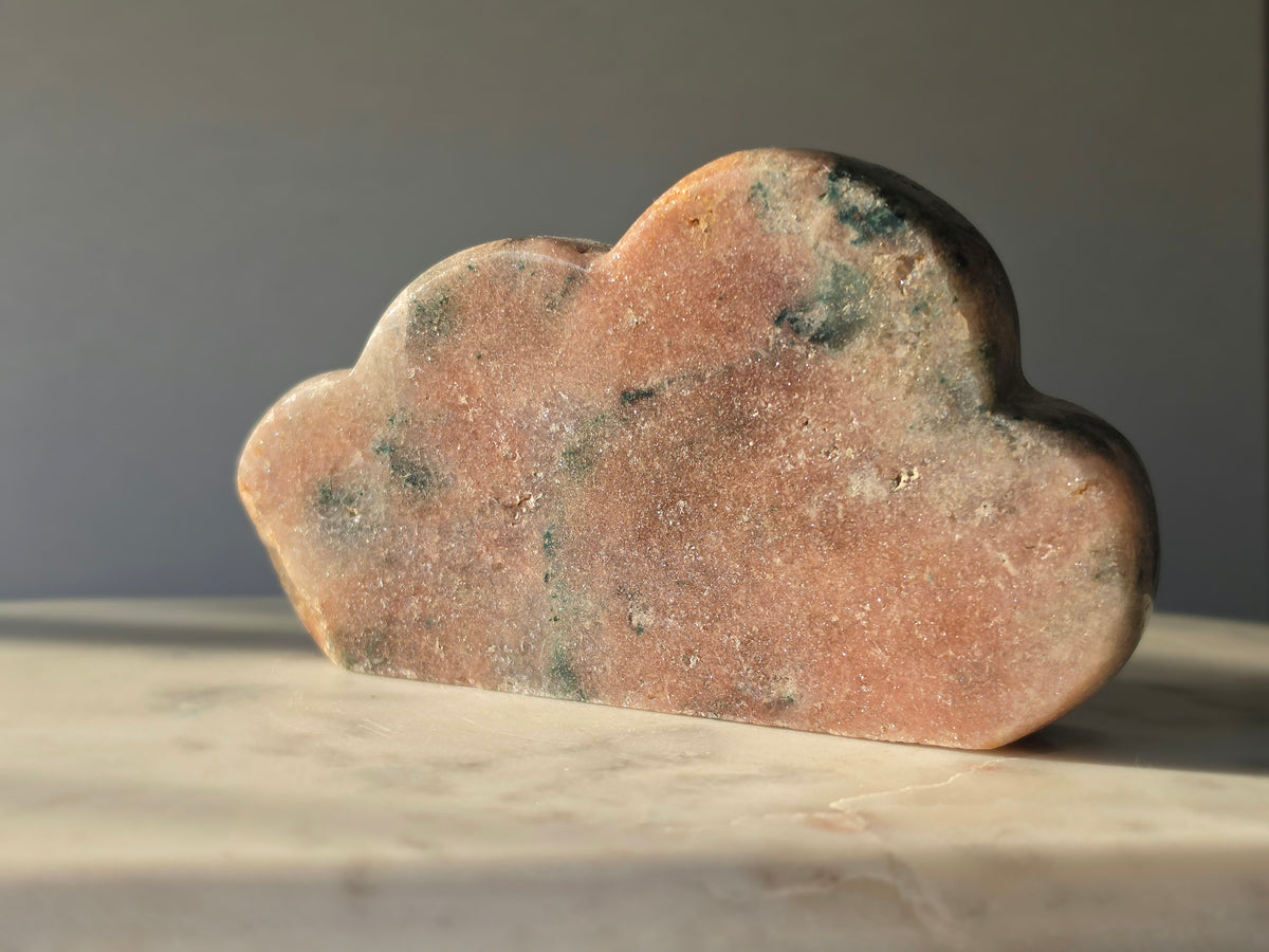 Natural Brazilian Pink Amethyst Cloud with soft blush pink and peach tones, unique blue-green mineral inclusions and polished sculptural finish
