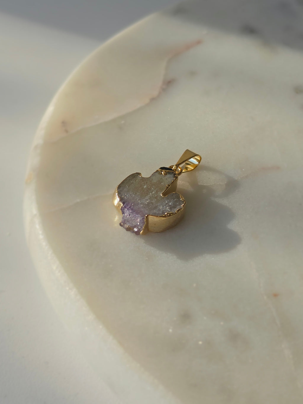 Amethyst and agate cactus slice pendant featuring purple crystal formations and a 24K gold-plated outline.
