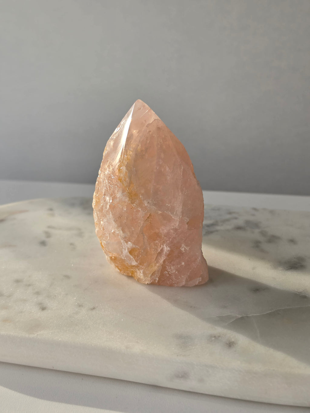 Chunky Rose Quartz and Golden Healer Quartz tower with soft blush pink colouring, warm golden inclusions and a combination of raw crystal texture and polished surfaces