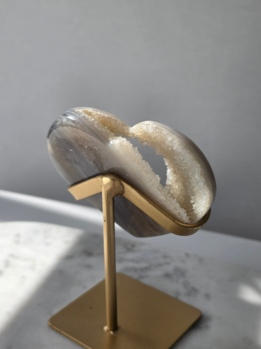 High clarity Druzy Agate Geode Heart on gold stand featuring sparkling druzy crystals, natural agate banding and champagne, taupe and smoky grey tones