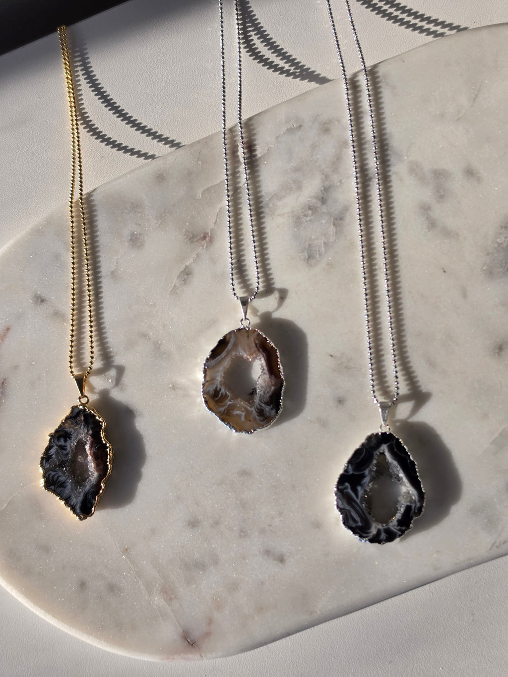 "Brazilian Agate Geode Slice Pendant in natural [brown/black/grey] tones 24K gold plated with sparkling druzy crystal formations"