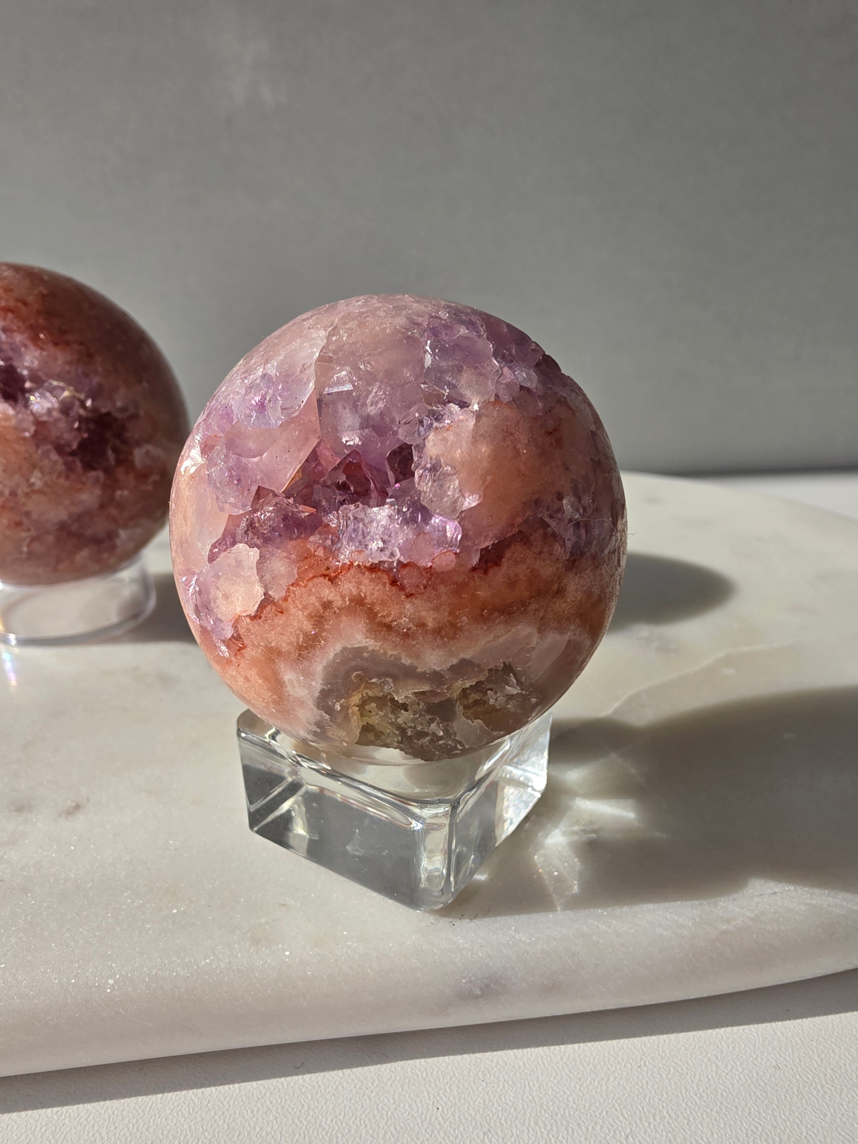 Luxury Pink Amethyst crystal sphere from Brazil with soft blush and lilac tones and a dramatic sparkling crystalline interior