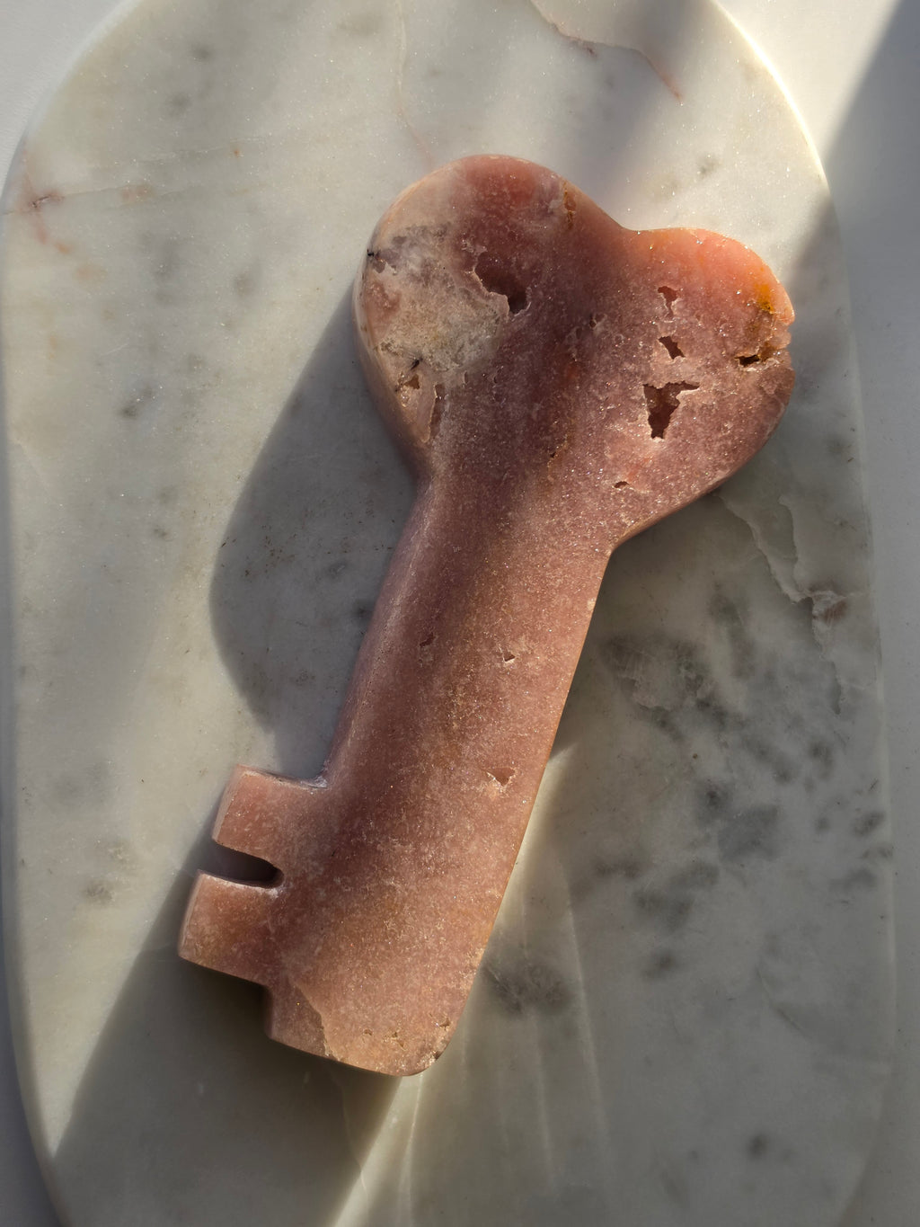 Pink Amethyst Love Heart Key crystal carving with natural sparkling druzy bubble formations, blush pink tones and polished stone details.