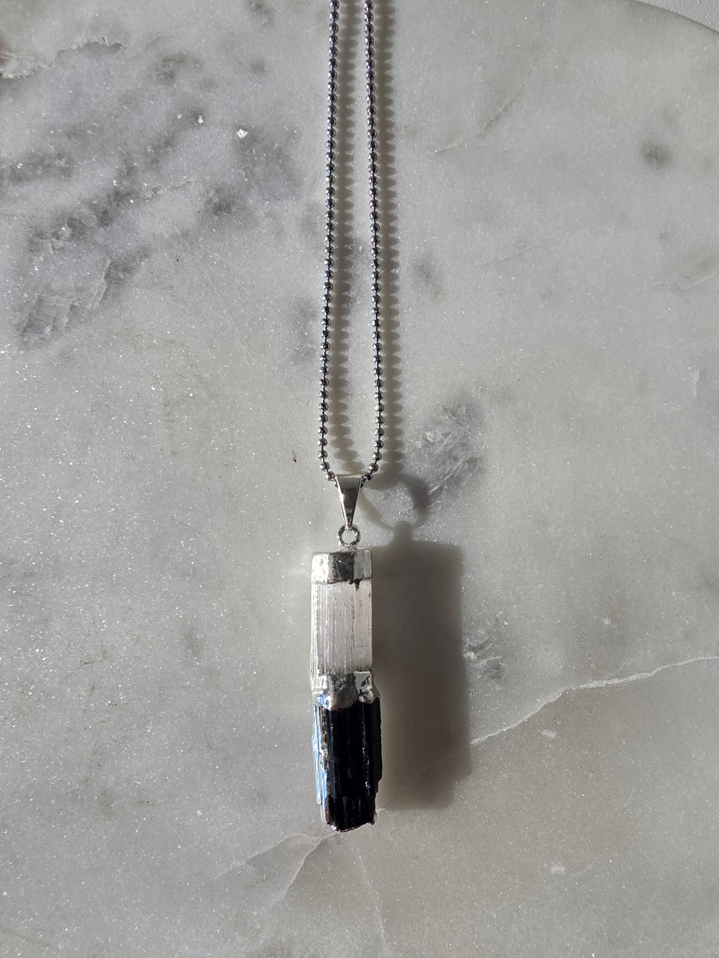 Natural Selenite and Black Tourmaline crystal pendant in a refined Premium Silver Plated setting, Stone & Bloom Raw Luxe Collection
