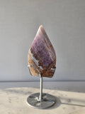 Amethyst Lace Agate flame on a silver stand featuring soft lavender, lilac and creamy white natural banding and intricate lace-like patterns, luxury crystal décor.