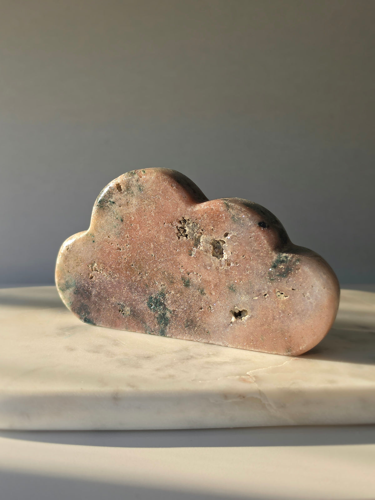 Natural Brazilian Pink Amethyst Cloud with soft blush pink and peach tones, unique blue-green mineral inclusions and polished sculptural finish