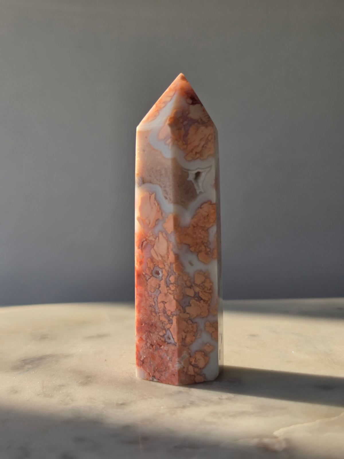 Shop this exquisite Cotton Candy Agate Point, featuring delicate flower-like plume formations in dreamy blush pink, peach and white - grey tones.