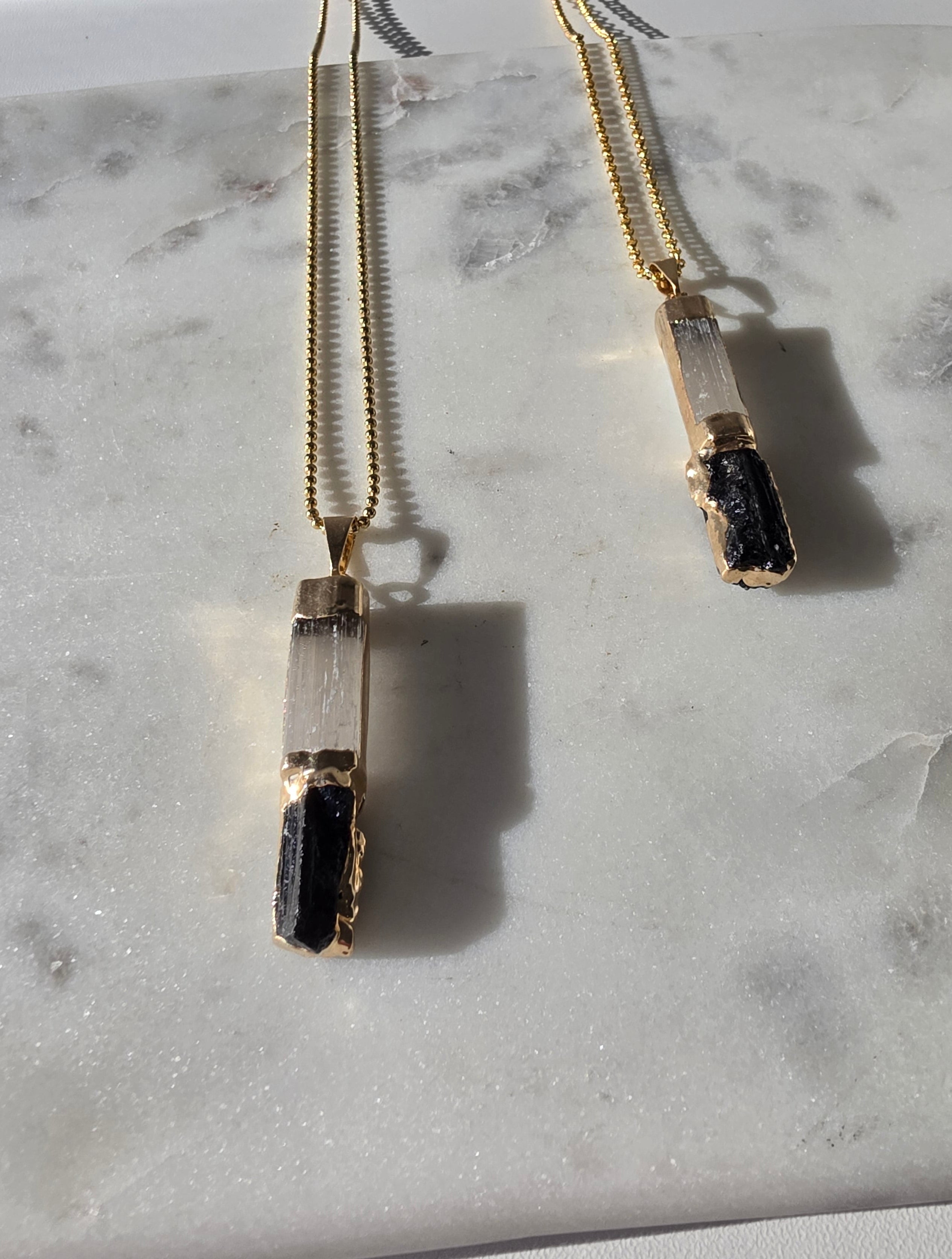 Natural Selenite and Black Tourmaline crystal pendant in a refined 24K Gold Plated setting, Stone & Bloom Raw Luxe Collection