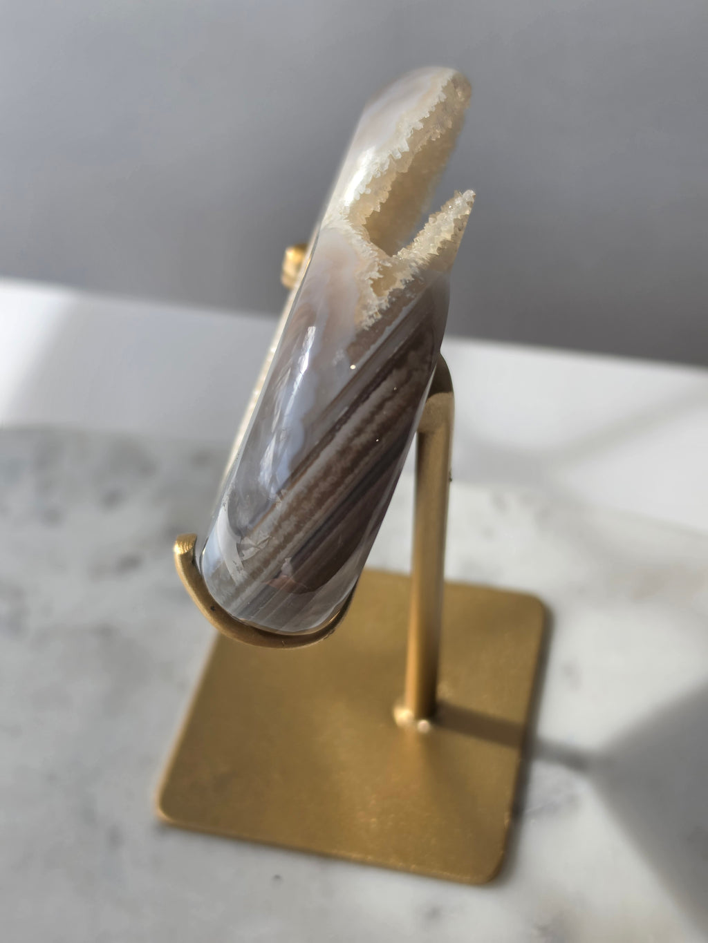 High clarity Druzy Agate Geode Heart on gold stand featuring sparkling druzy crystals, natural agate banding and champagne, taupe and smoky grey tones