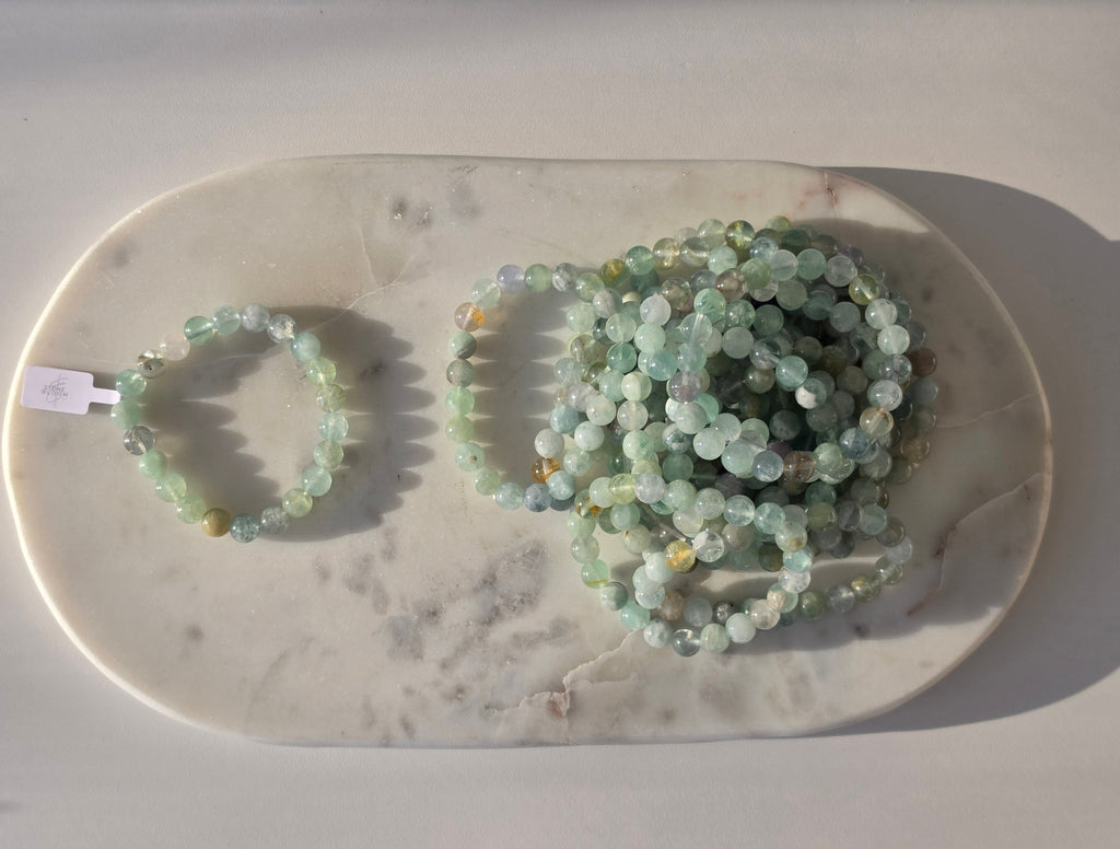 Natural Green Fluorite bracelet with polished translucent mint-green gemstone beads, luxury crystal jewellery by Stone & Bloom.