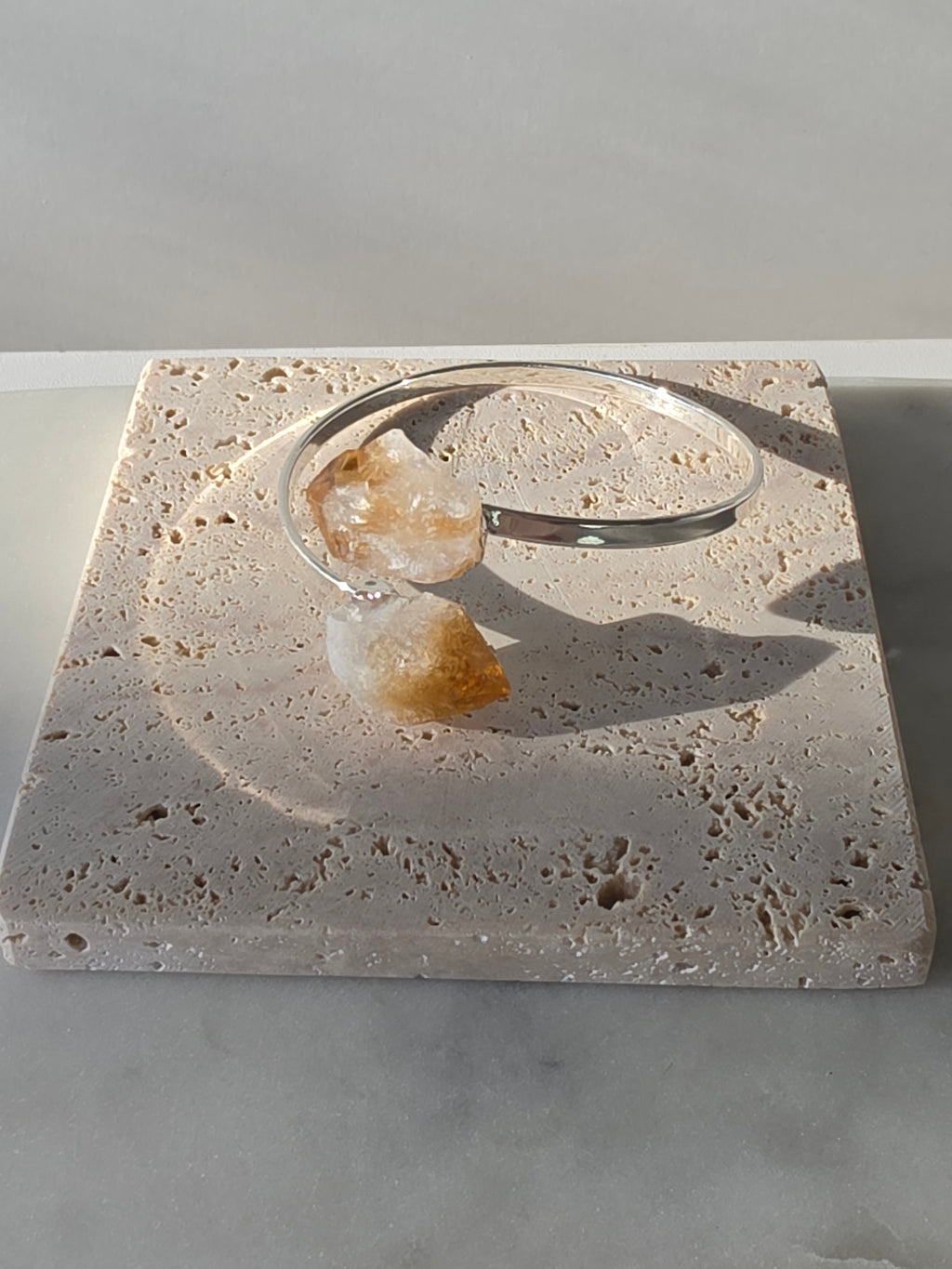 Stone & Bloom Raw Luxe Brazilian Rough Citrine wrap bracelet with genuine rough Citrine crystals and premium 1-micron silver plating on an elegant open cuff.
