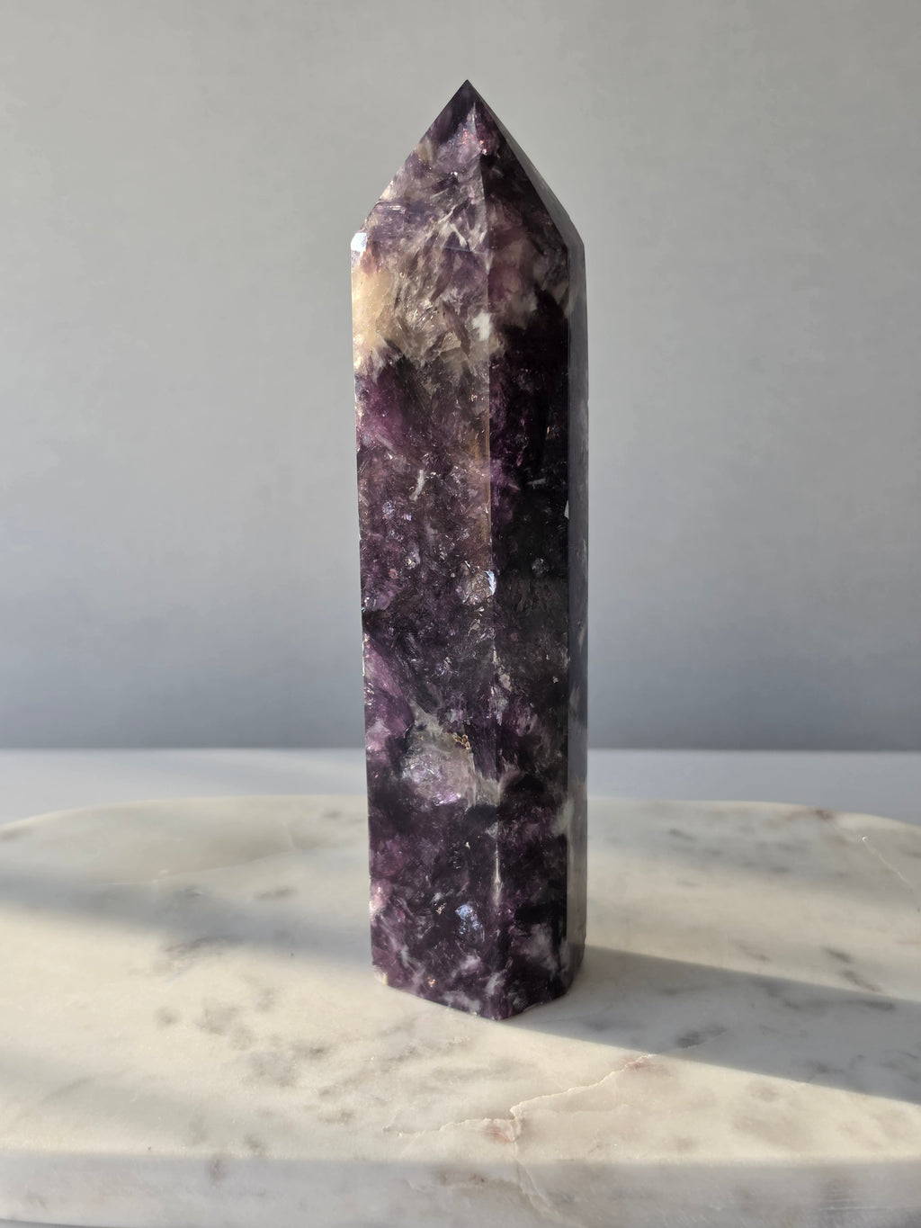 Natural Lepidolite crystal tower with rich purple tones, sparkling mica inclusions and unique lavender mineral formations