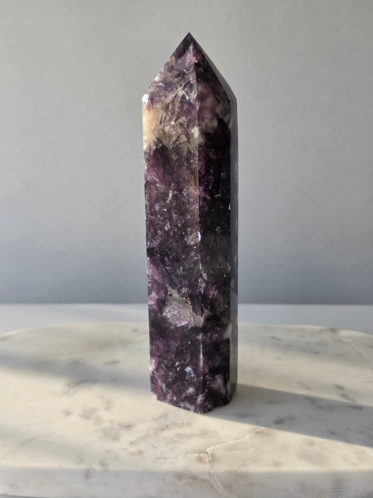 Natural Lepidolite crystal tower with rich purple tones, sparkling mica inclusions and unique lavender mineral formations