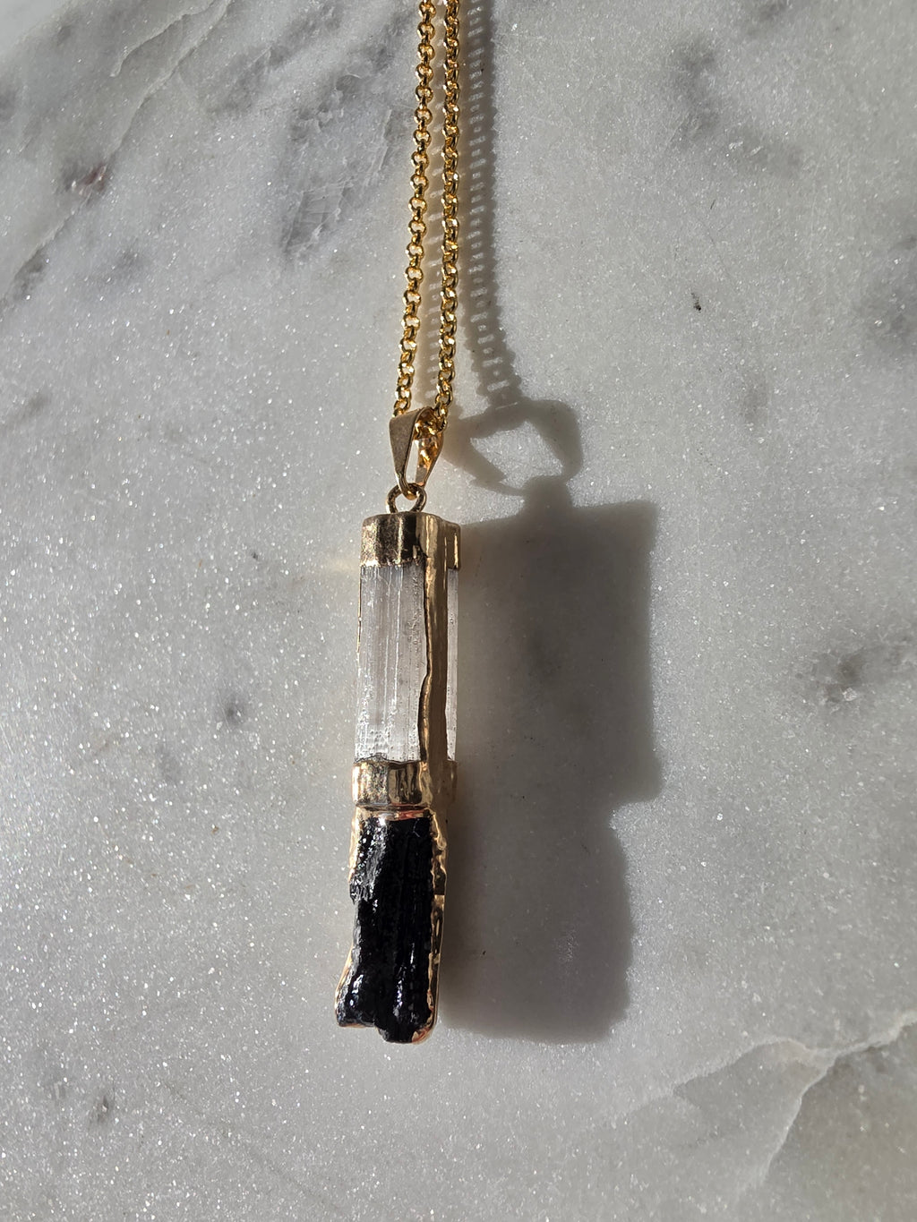 Natural Selenite and Black Tourmaline crystal pendant in a refined 24K Gold Plated setting, Stone & Bloom Raw Luxe Collection