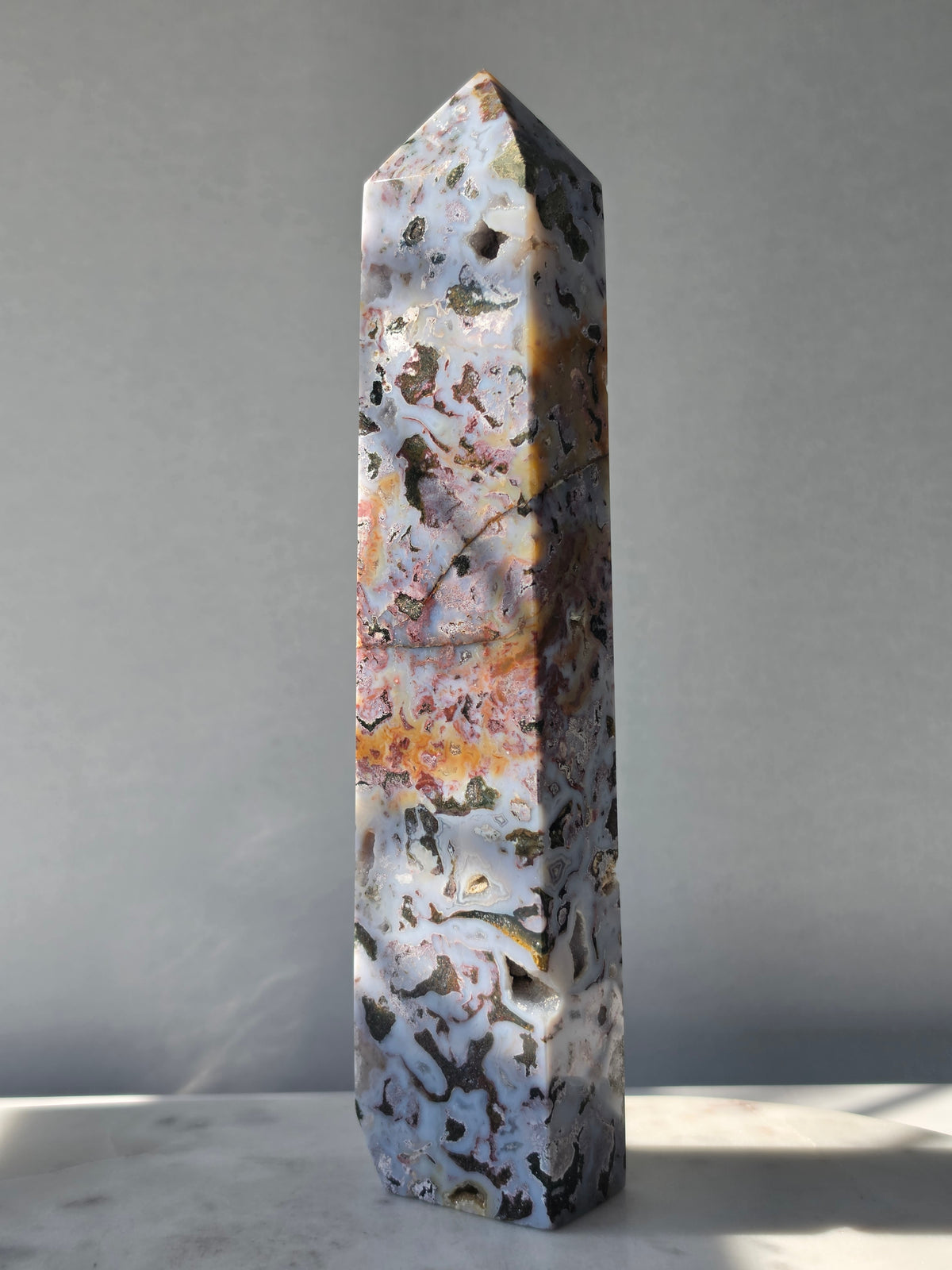 21.5cm Orbicular Ocean Jasper weighing 594g with translucent jelly-like pockets, sparkling druzy formations and intricate natural orbicular patterns
