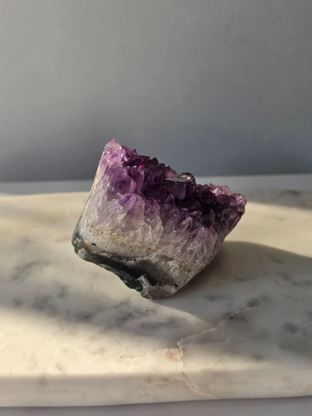 Natural Amethyst freeform cluster with deep purple and lavender crystal formations and dark natural matrix