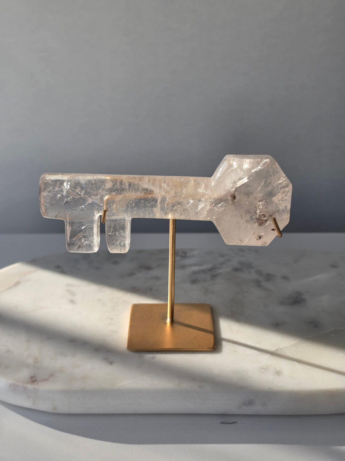 High-clarity Clear Quartz skeleton key crystal carving with stunning rainbow flashes and natural internal line formations, 13cm long.