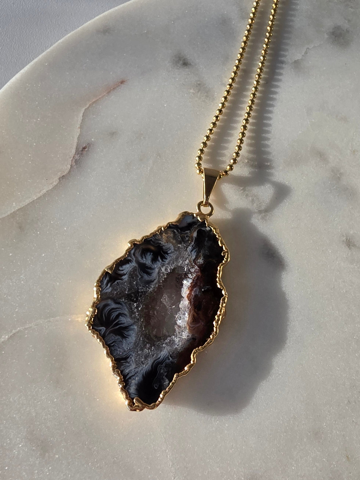 "Brazilian Agate Geode Slice Pendant in natural [brown/black/grey] tones 24K gold plated with sparkling druzy crystal formations"