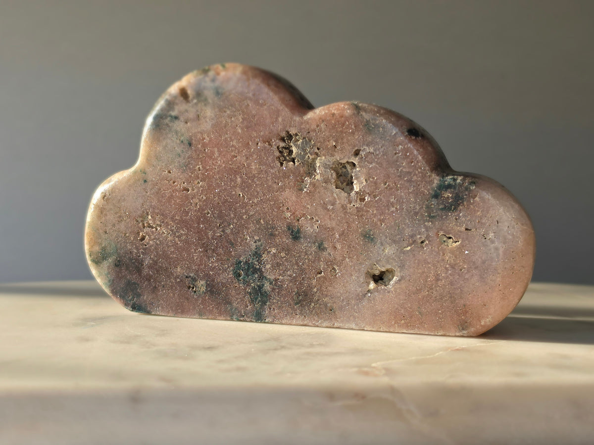 Natural Brazilian Pink Amethyst Cloud with soft blush pink and peach tones, unique blue-green mineral inclusions and polished sculptural finish
