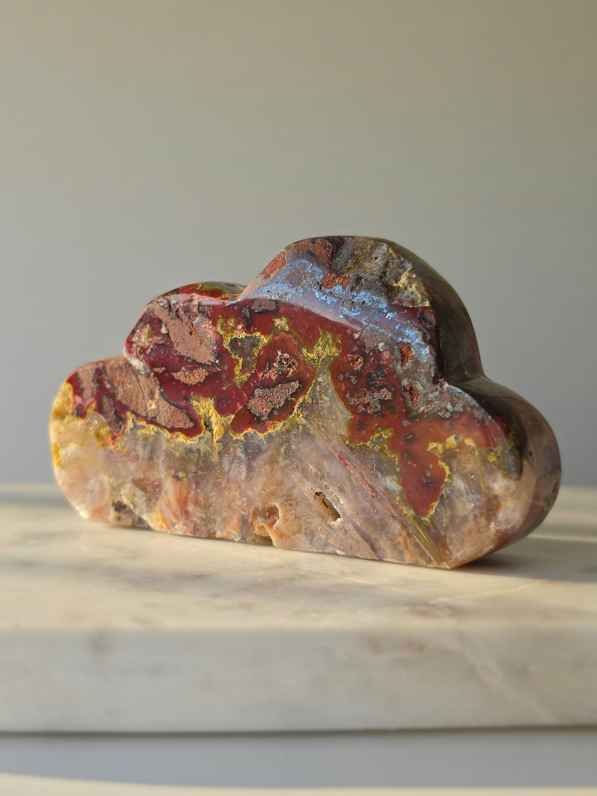 Back of natural Brazilian Pink Amethyst Cloud showing translucent Quartz, intricate splinter-like formations and rich red, gold and earthy mineral tones