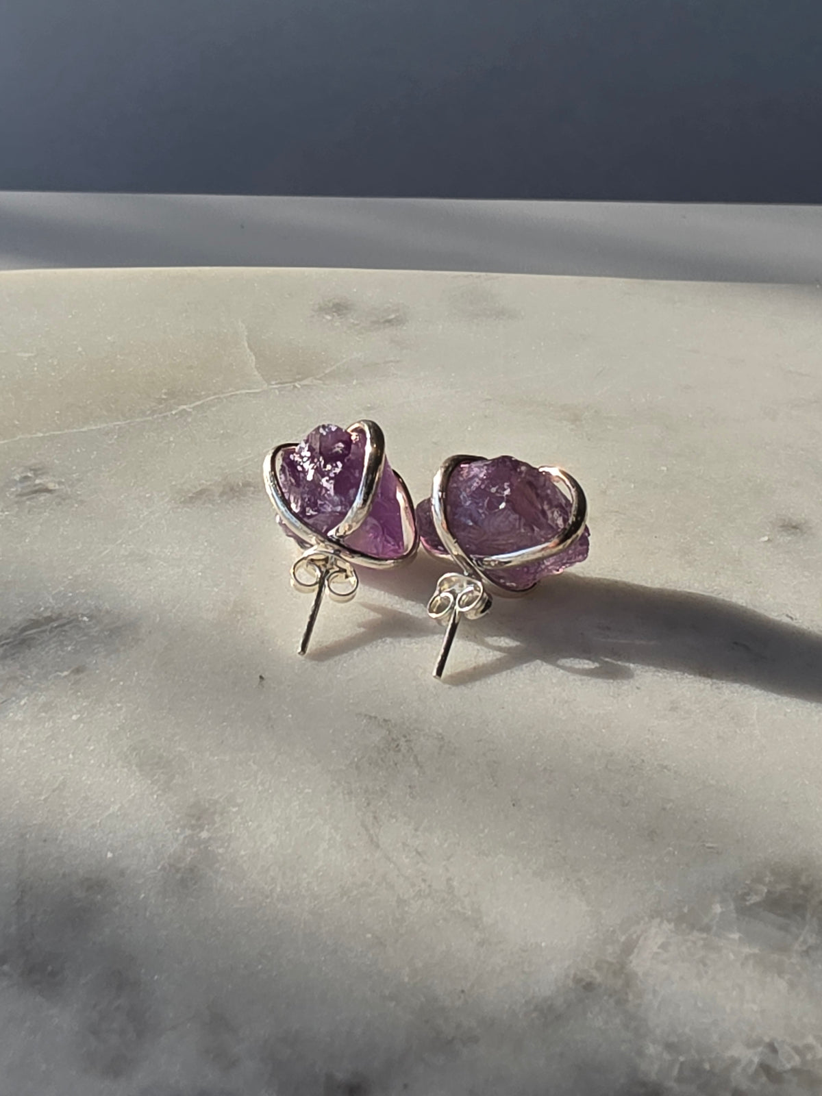 Natural raw Amethyst crystal stud earrings in a four-claw silver setting, Raw Luxe Collection