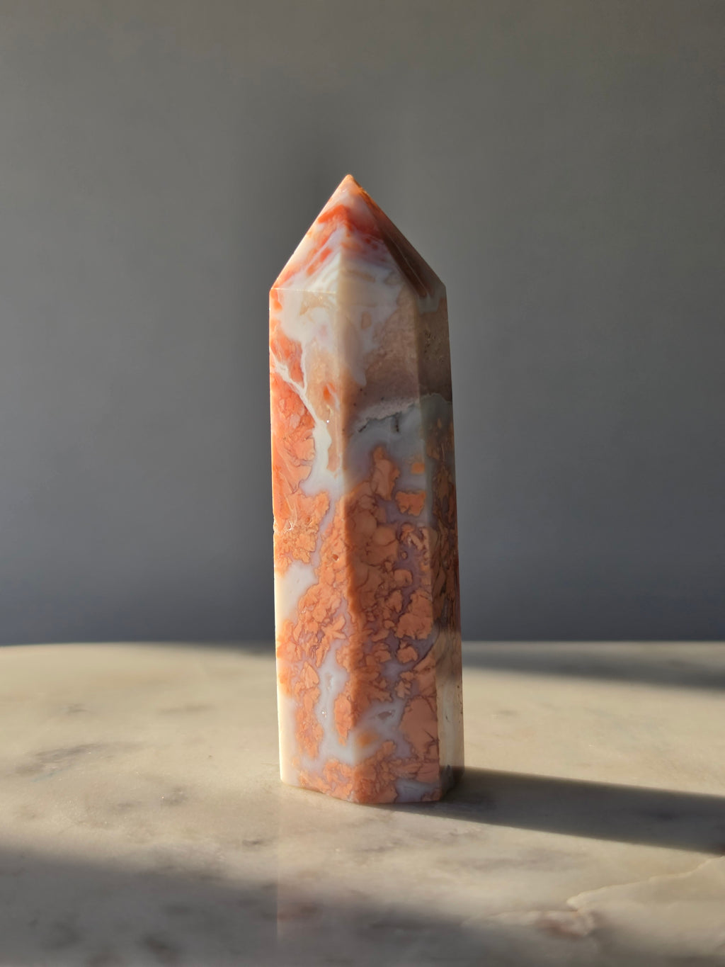 Shop this exquisite Cotton Candy Agate Point, featuring delicate flower-like plume formations in dreamy blush pink, peach and blue-grey tones.