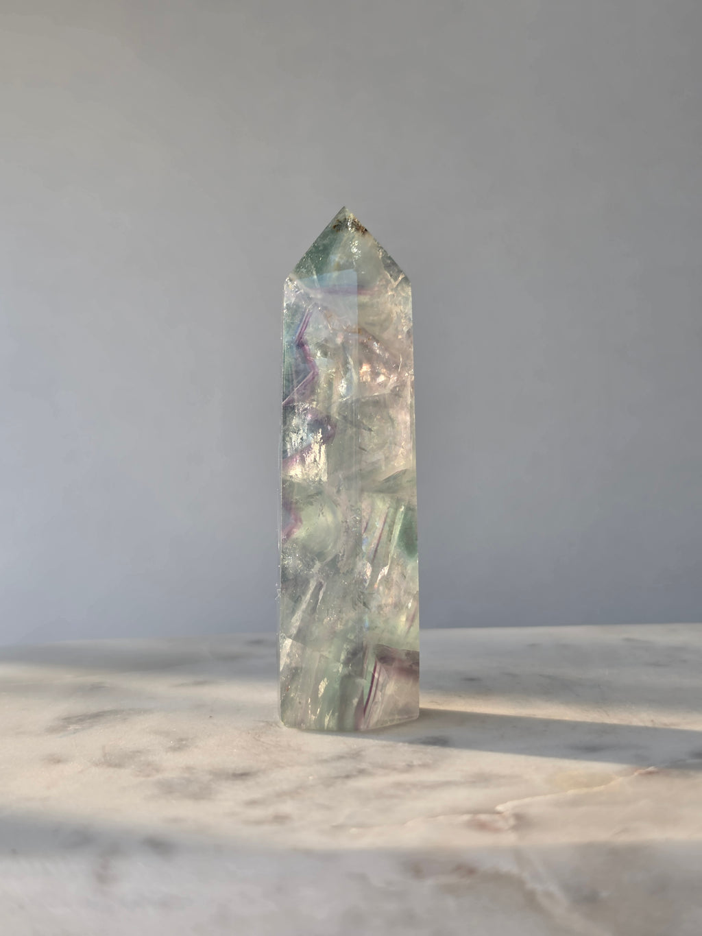Natural Fluorite crystal point Translucent clarity with rainbow shine purple and light green colour zoning, transparent polished finish and unique internal formations