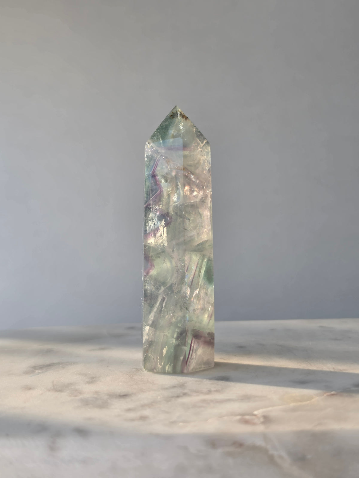 Natural Fluorite crystal point Translucent clarity with rainbow shine purple and light green colour zoning, transparent polished finish and unique internal formations