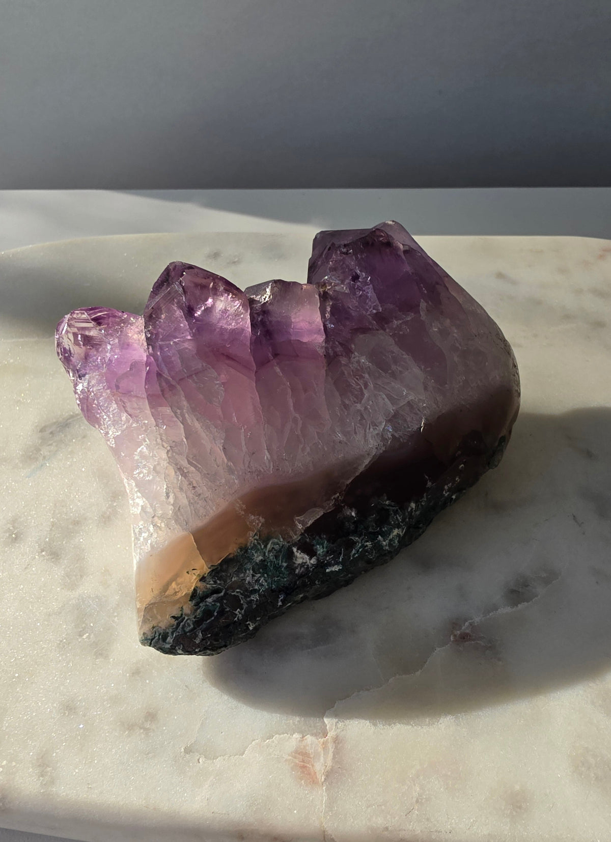 Intense purple Amethyst polished freeform with raw chunky crystal formations and natural Goethite and Hematite inclusions