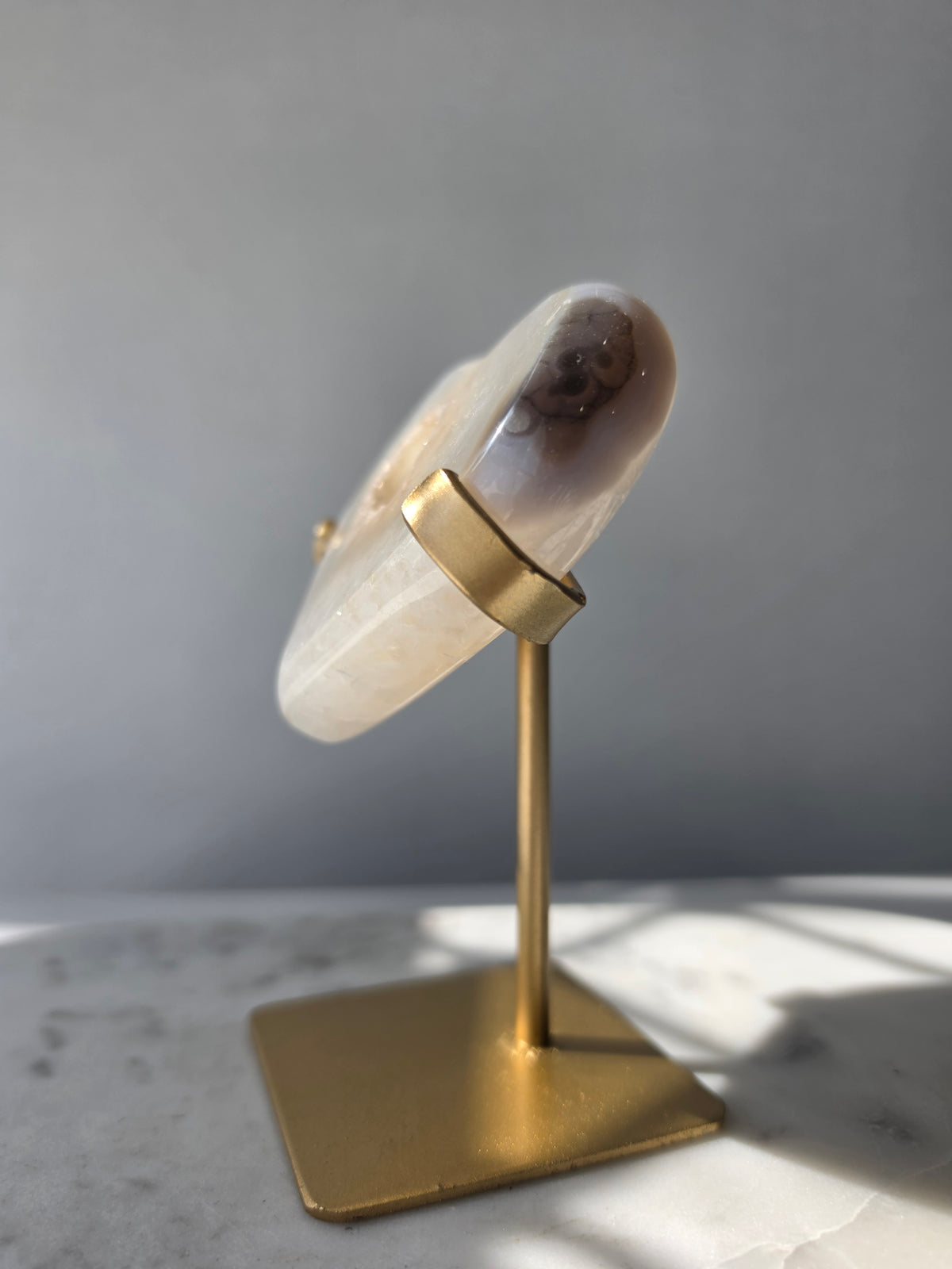 High Clarity Druzy Agate Geode Heart on a gold stand featuring sparkling druzy quartz crystals and natural champagne, caramel, ivory, taupe and smoky-grey agate banding.